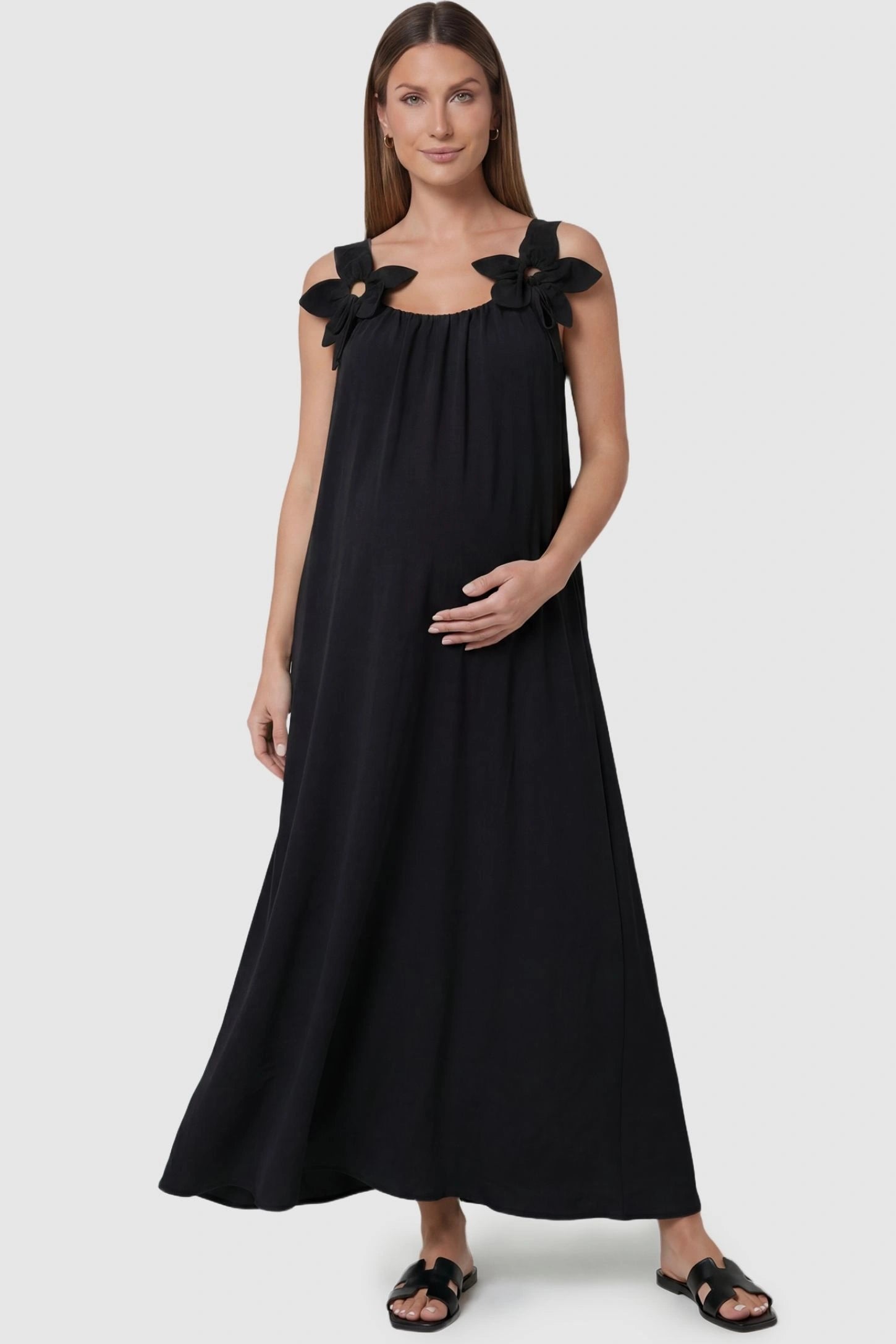 Black Bow Strap A-Line Maternity Dress with oversized shoulder ties on a front-facing pregnant model.