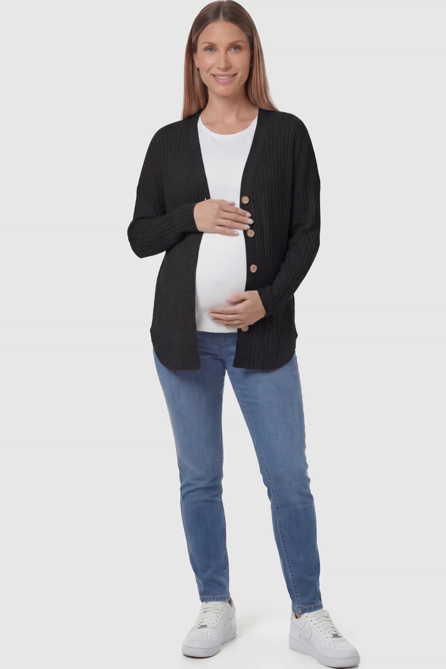 Button Down Ribbed Knit Maternity Cardigan in Black featuring a functional buttons on a pregnant woman.