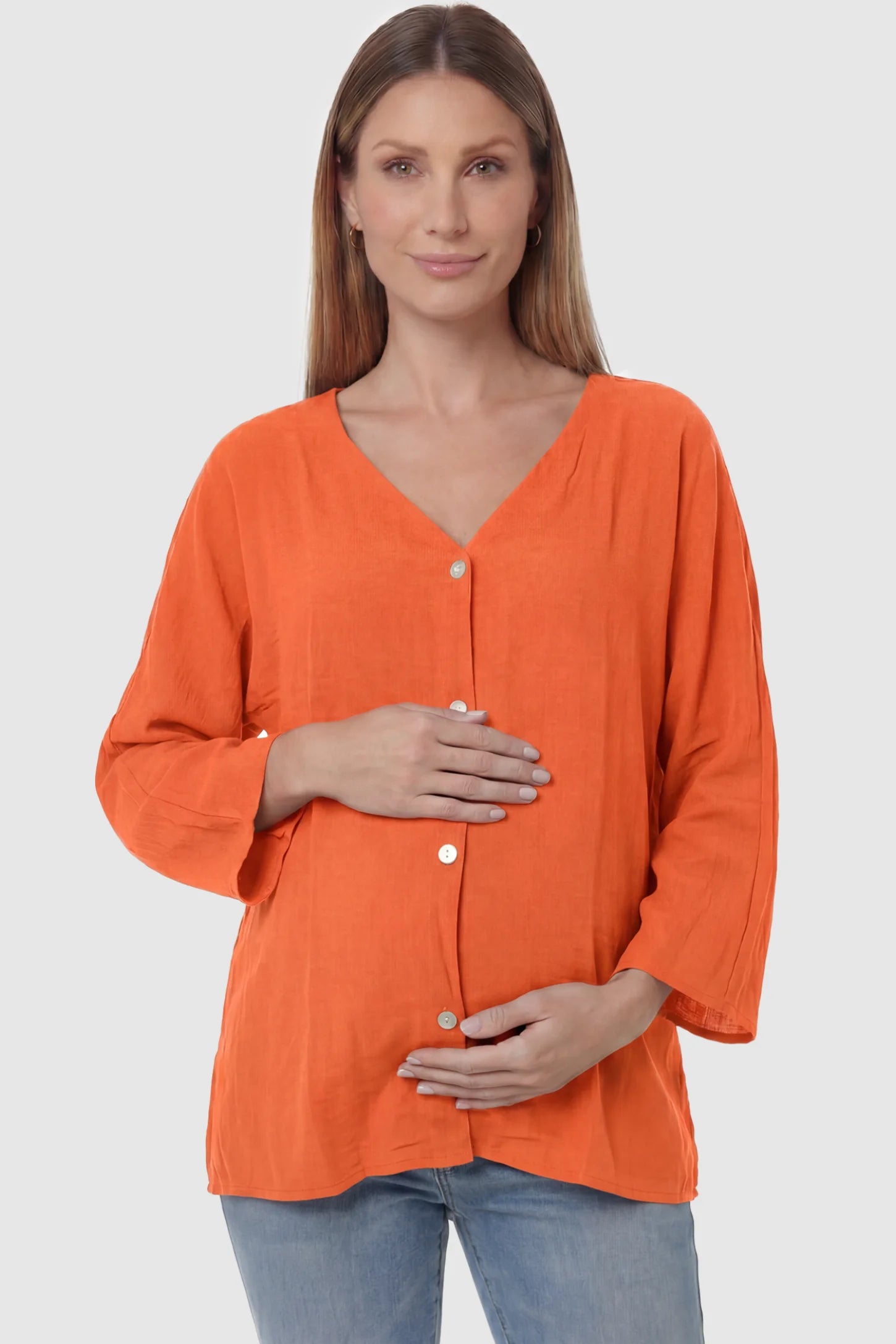 Button Down V-Neck Long Sleeve Maternity Top in Orange featuring a relaxed drape on a pregnant model, front view.