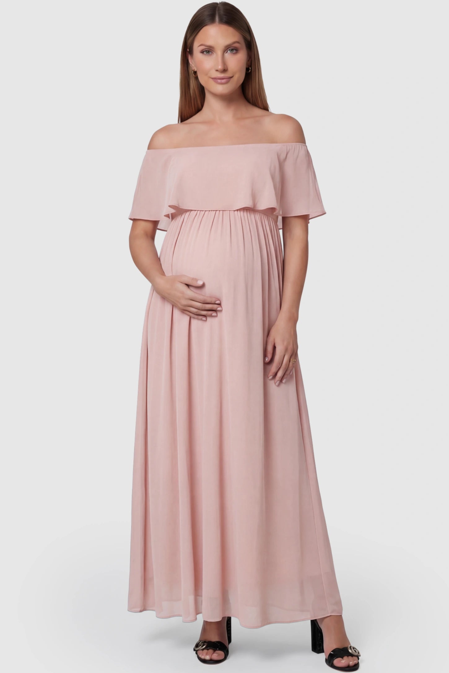 Chiffon Off-Shoulder Maternity Maxi Dress in Pink featuring a Floor-length on a pregnant model showing front.