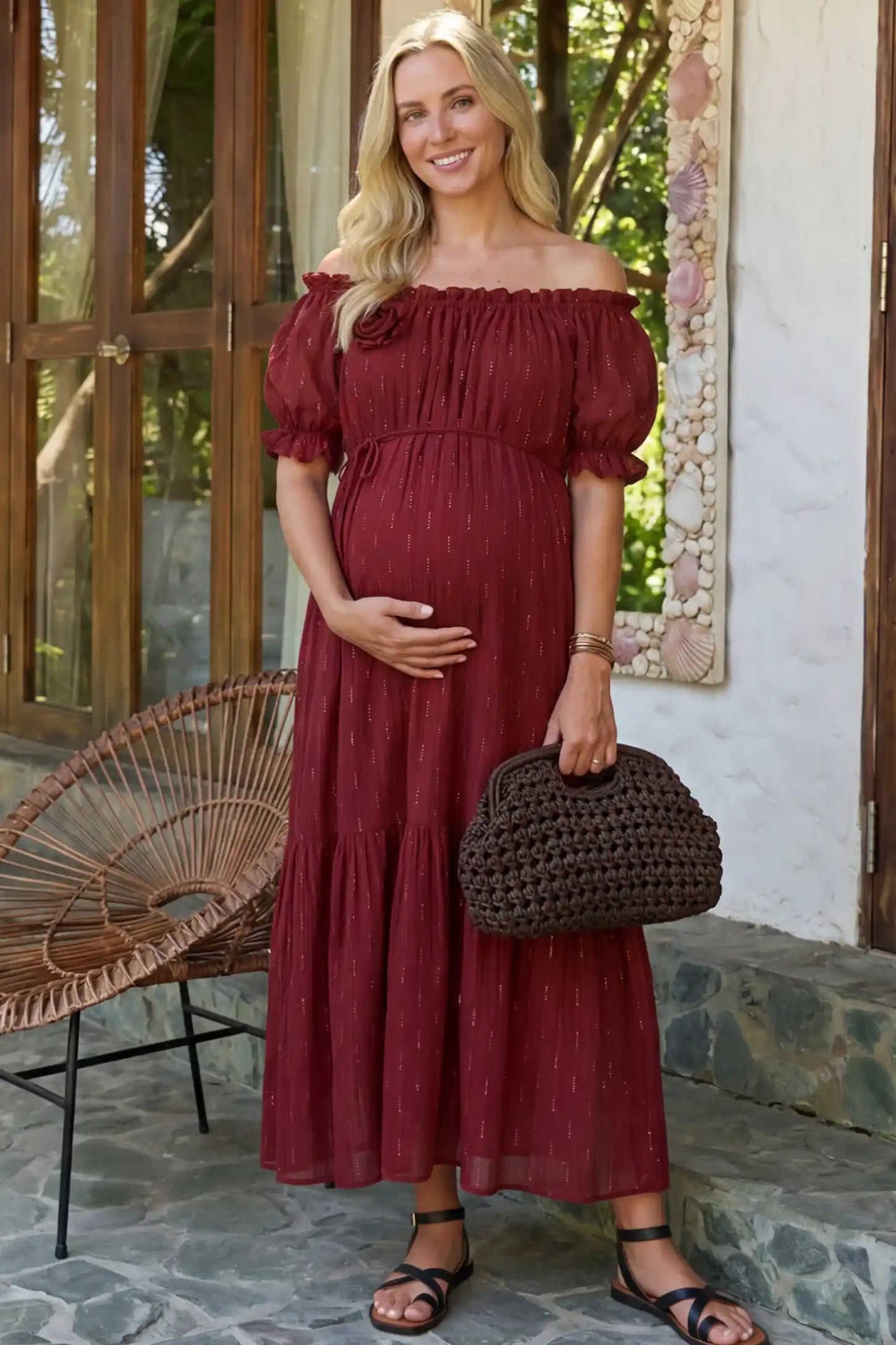Convertible Neck Tiered Maternity Midi Dress in Red featuring elastic waist tie, short sleeves on a pregnant woman in outdoor setting, front view.