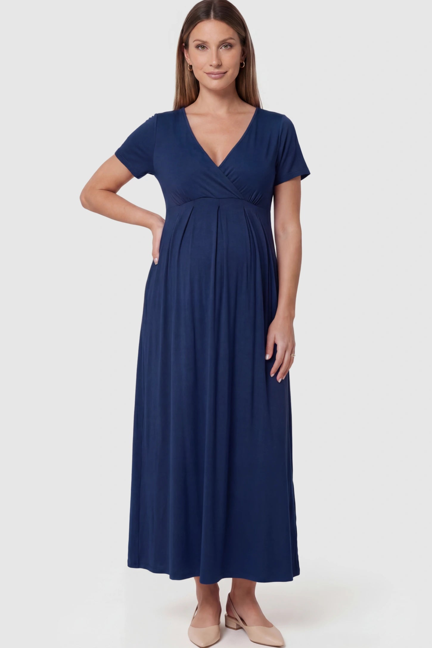 Solid V-Neck Maxi Maternity Dress in Blue featuring breathable cotton and a deep neckline on a pregnant model showing front.