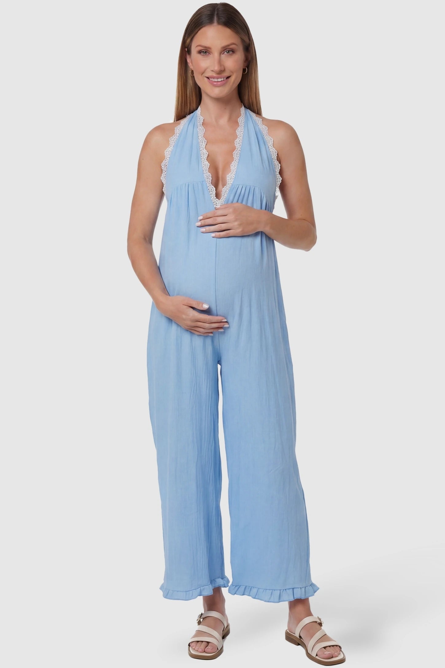 Deep V-Neck Lace Trim Wide Leg Maternity Jumpsuit in Light Blue featuring delicate white lace trim neckline on a pregnant model, front view.