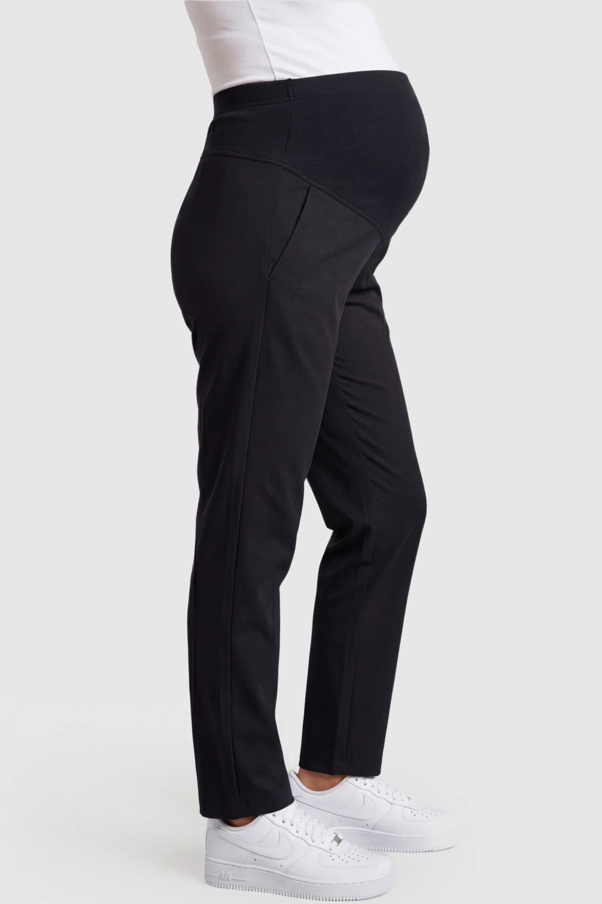 Elastic Mid Waist Straight Leg Maternity Pants in black featuring Elastic Waistband on a pregnant model showing side.