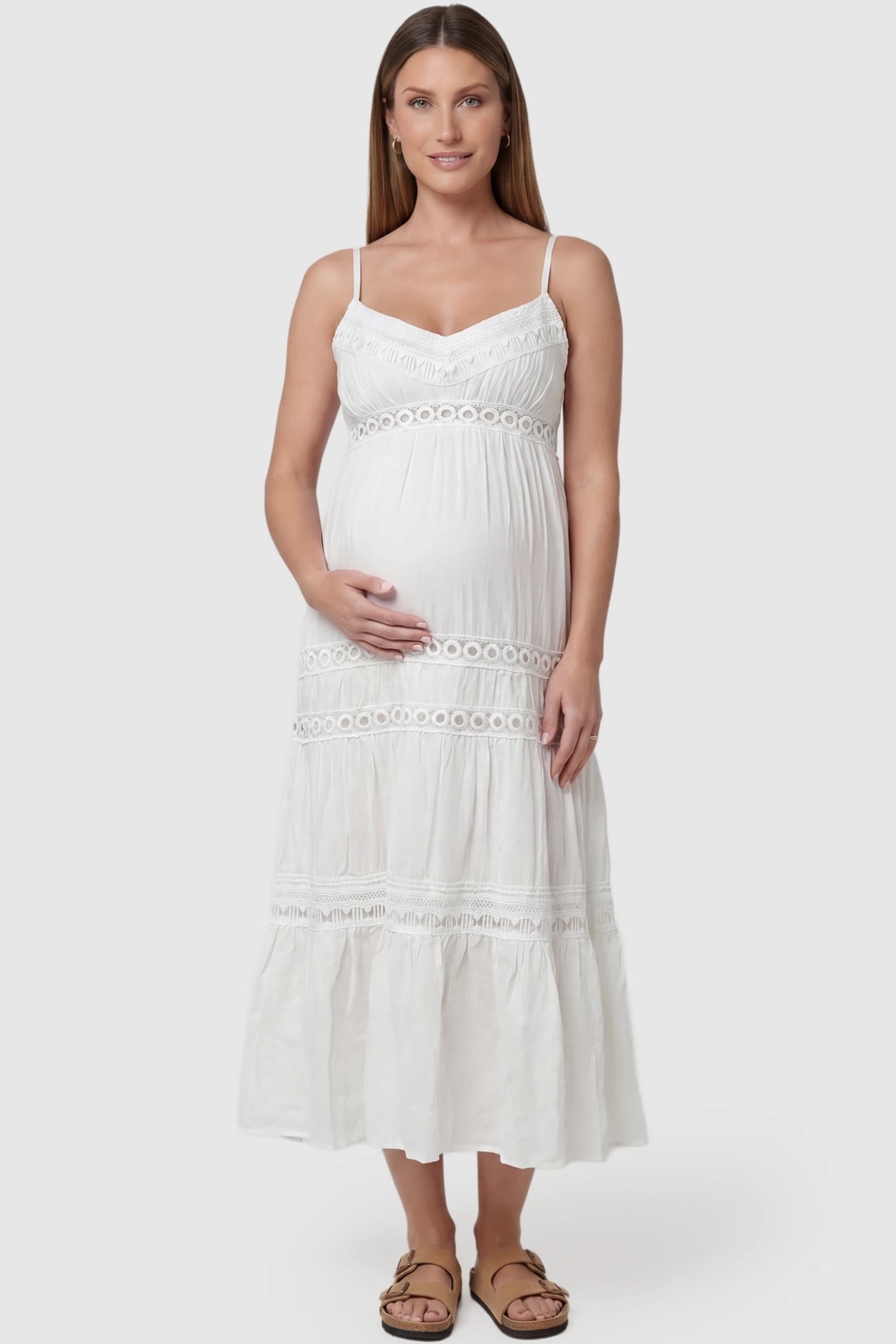 Eyelet Lace Cami Midi Maternity Dress in White featuring circle eyelet lace trim on a pregnant model, front view.
