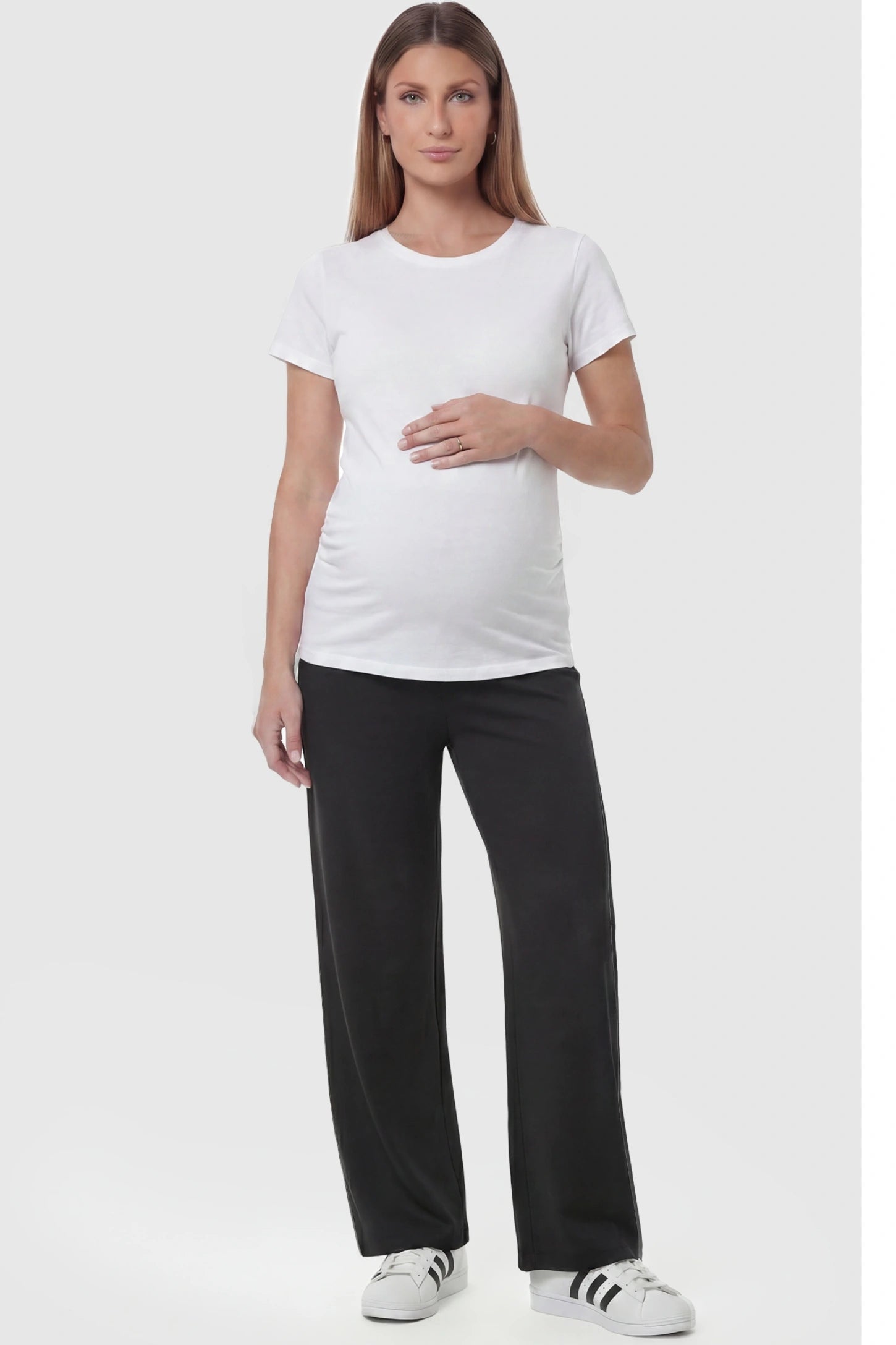 Fleece Straight-Leg Maternity Pants in Black featuring a soft elastic waistband on a pregnant model, full body view.