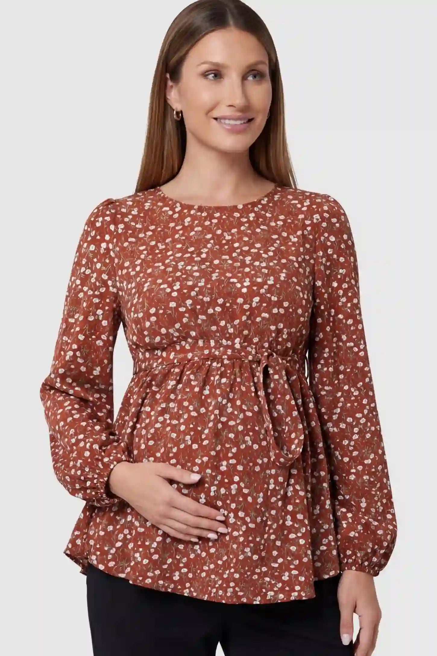 Floral Round Neck Babydoll Maternity Top in Red featuring an adjustable waist tie on a pregnant model.