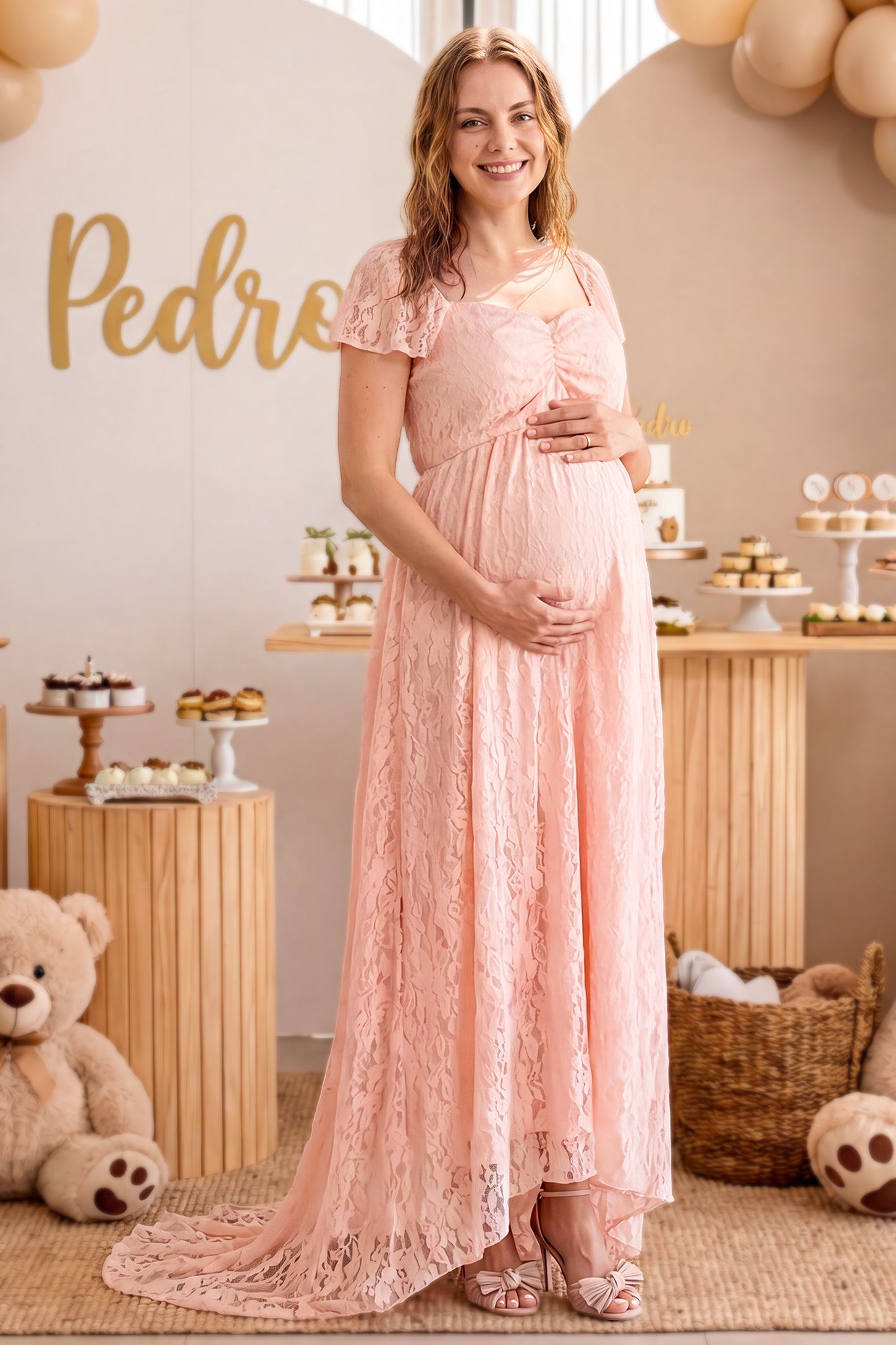 Floral Lace Flutter Sleeve Maternity Maxi Dress in Pink featuring sweetheart neckline on a pregnant woman posing front.