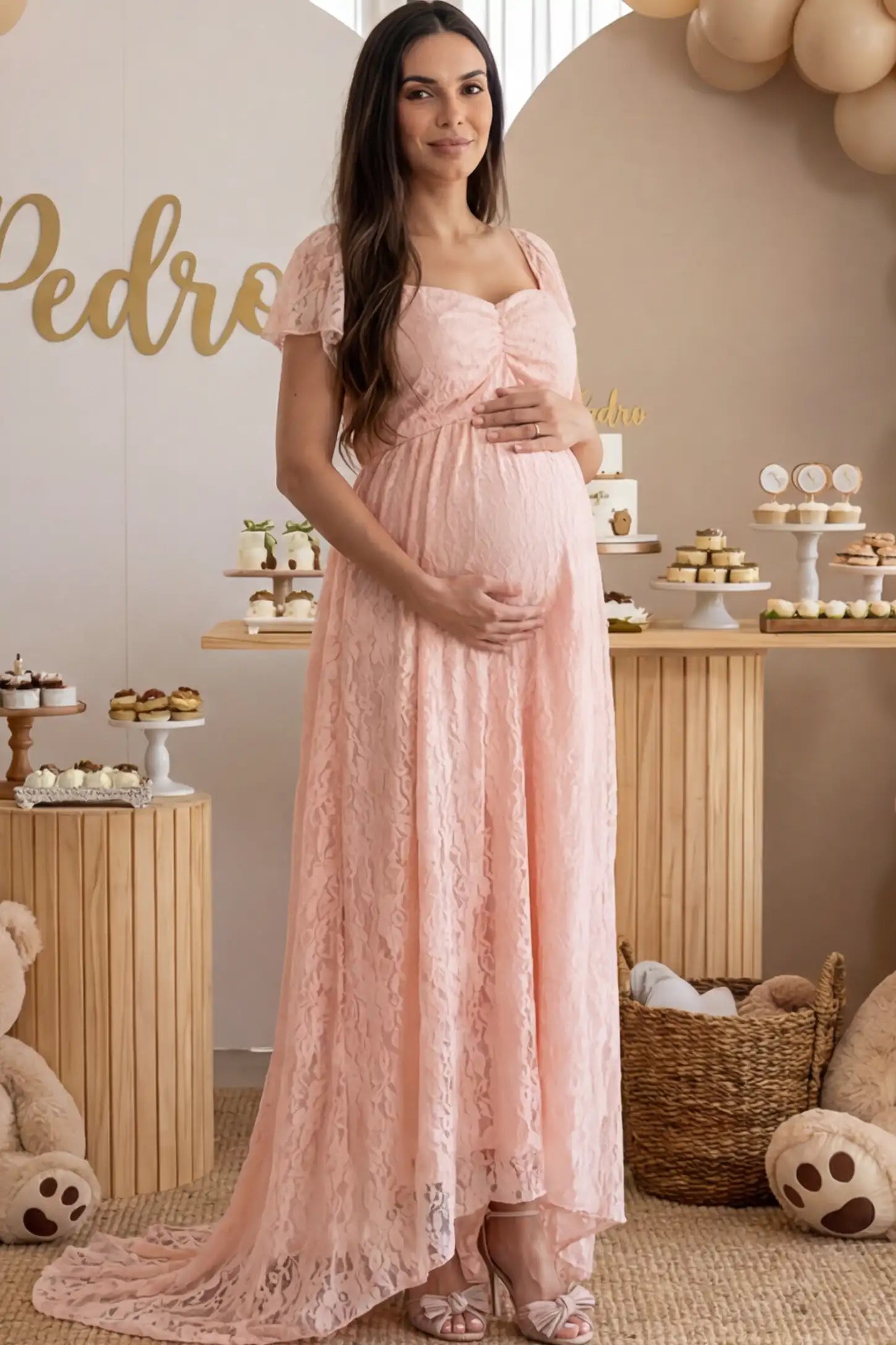 Floral Lace Flutter Sleeve Maternity Maxi Dress in Pink featuring sweetheart neckline on a pregnant woman posing front.
