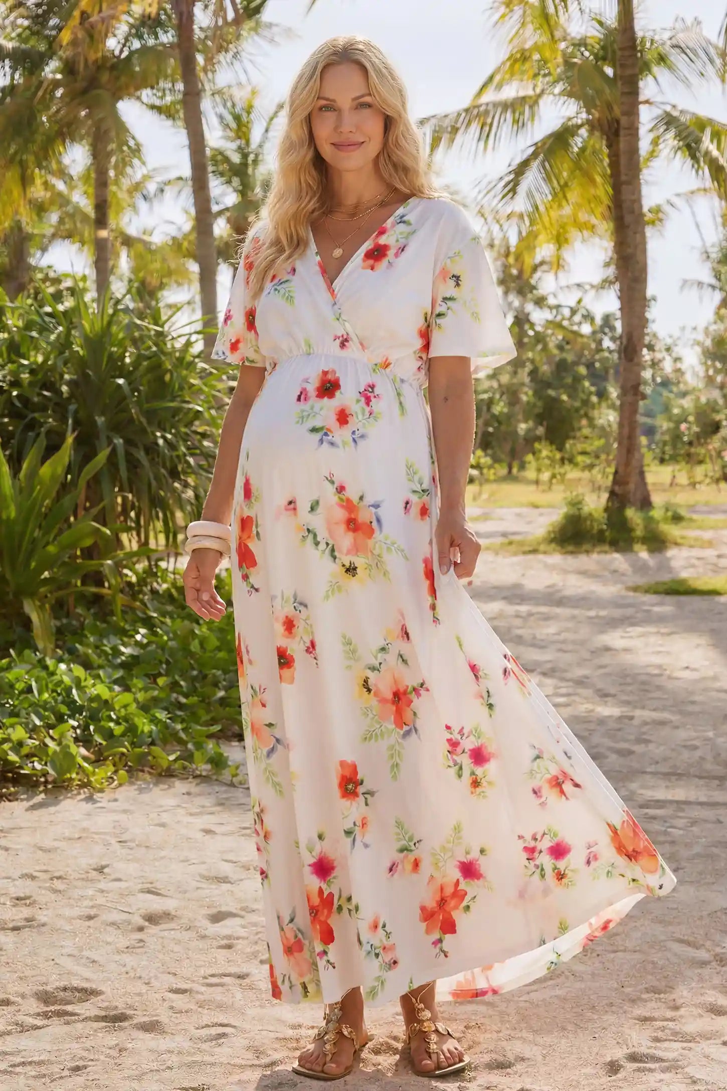 Floral Print V-Neck Maternity Maxi Dress in White featuring a vibrant floral pattern on a pregnant woman showing front.
