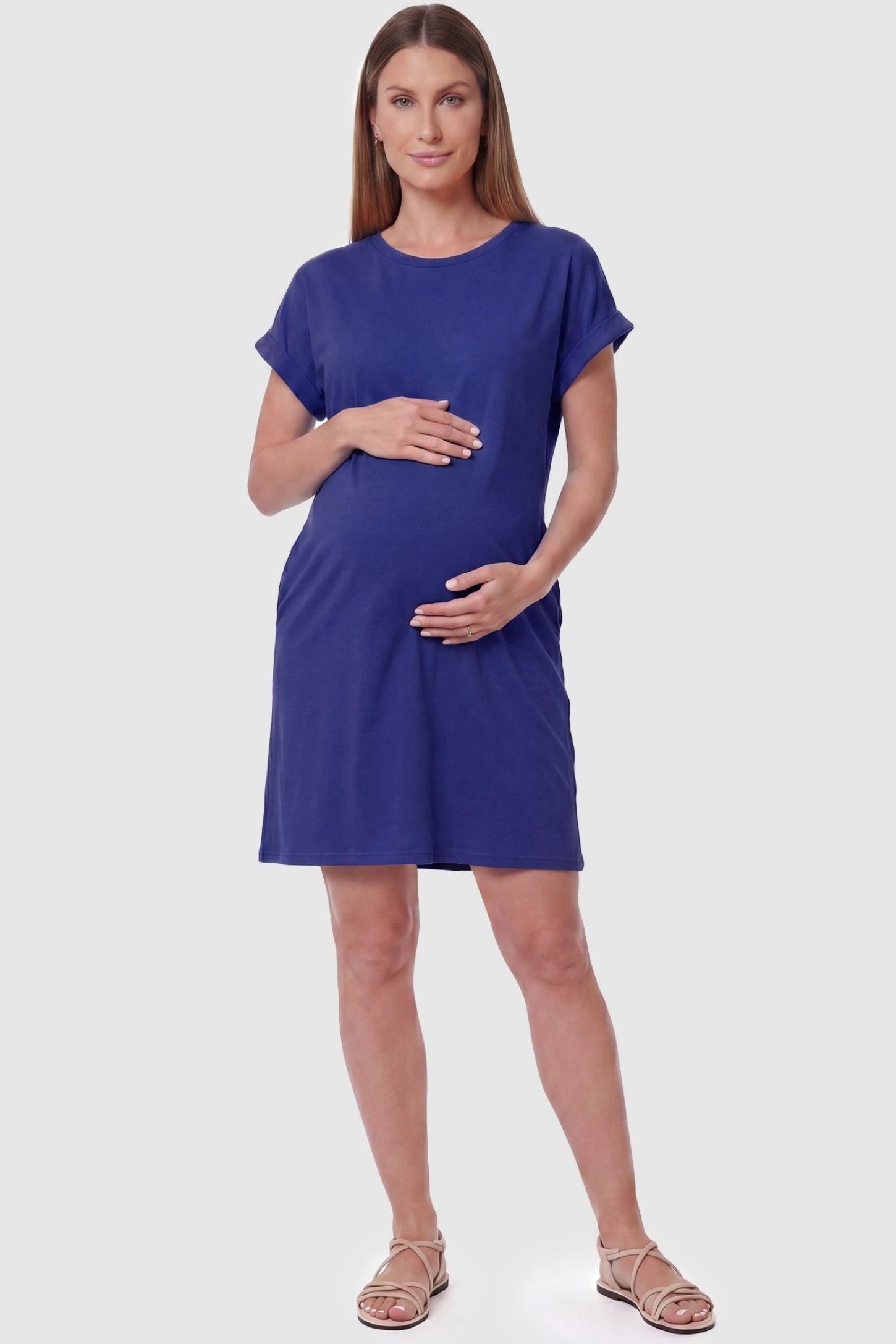 Flowy Pocket Tunic Maternity T-Shirt Dress in Blue featuring a relaxed fit on a front-view pregnant model.