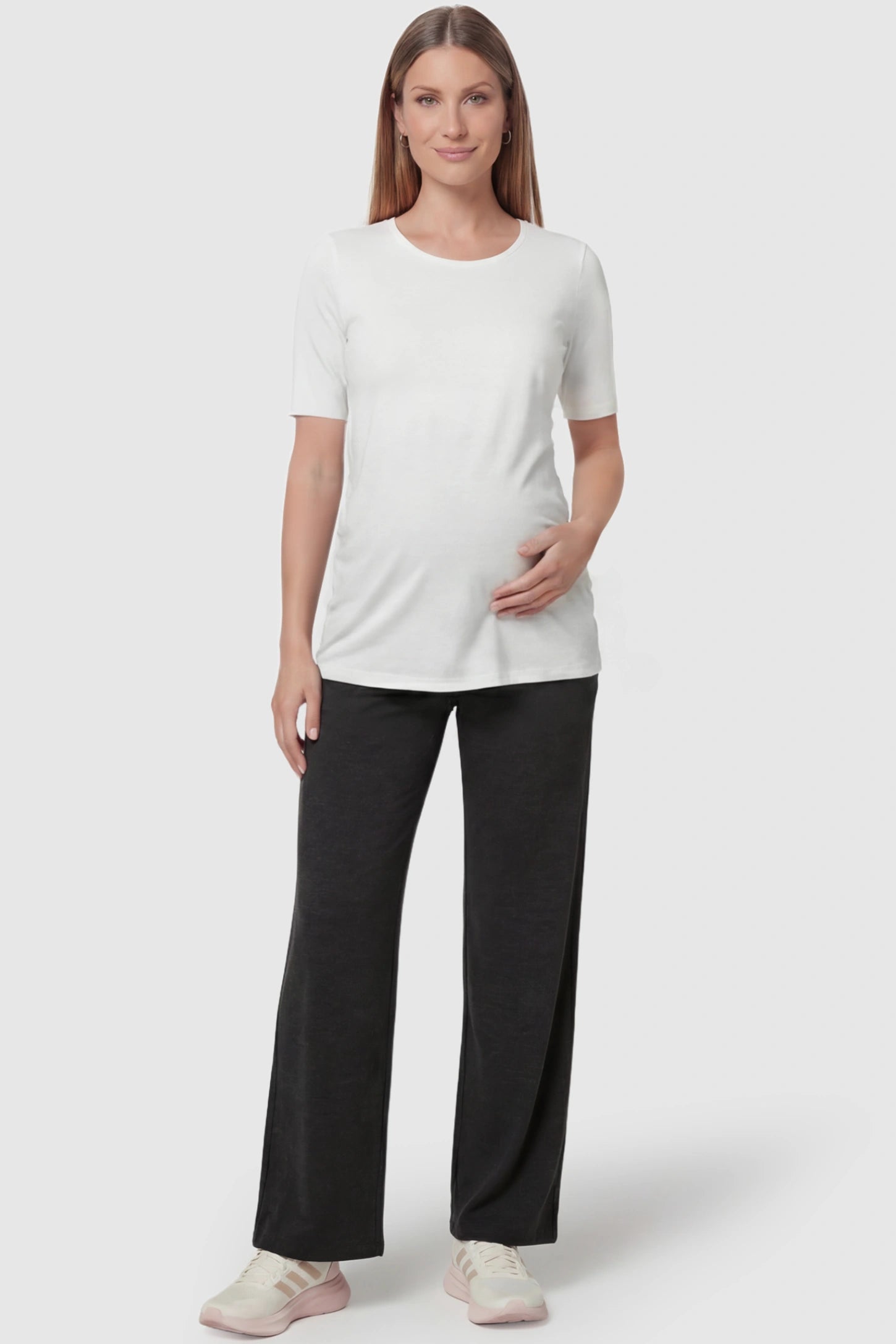 Fold-Over Waistband Wide Leg Maternity Pants in Black featuring a versatile high-waist fit on a pregnant model, front view.
