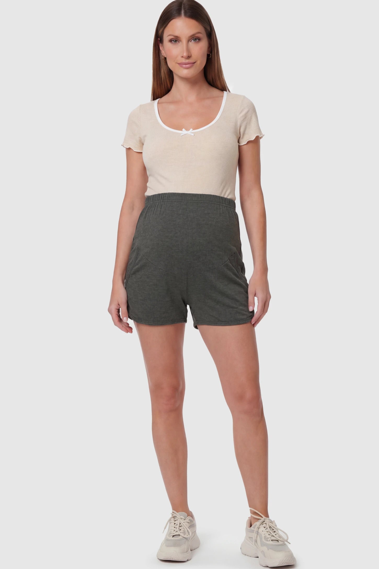Full Panel Maternity Lounge Shorts in Gray featuring a dolphin hem on a pregnant model showing full body.