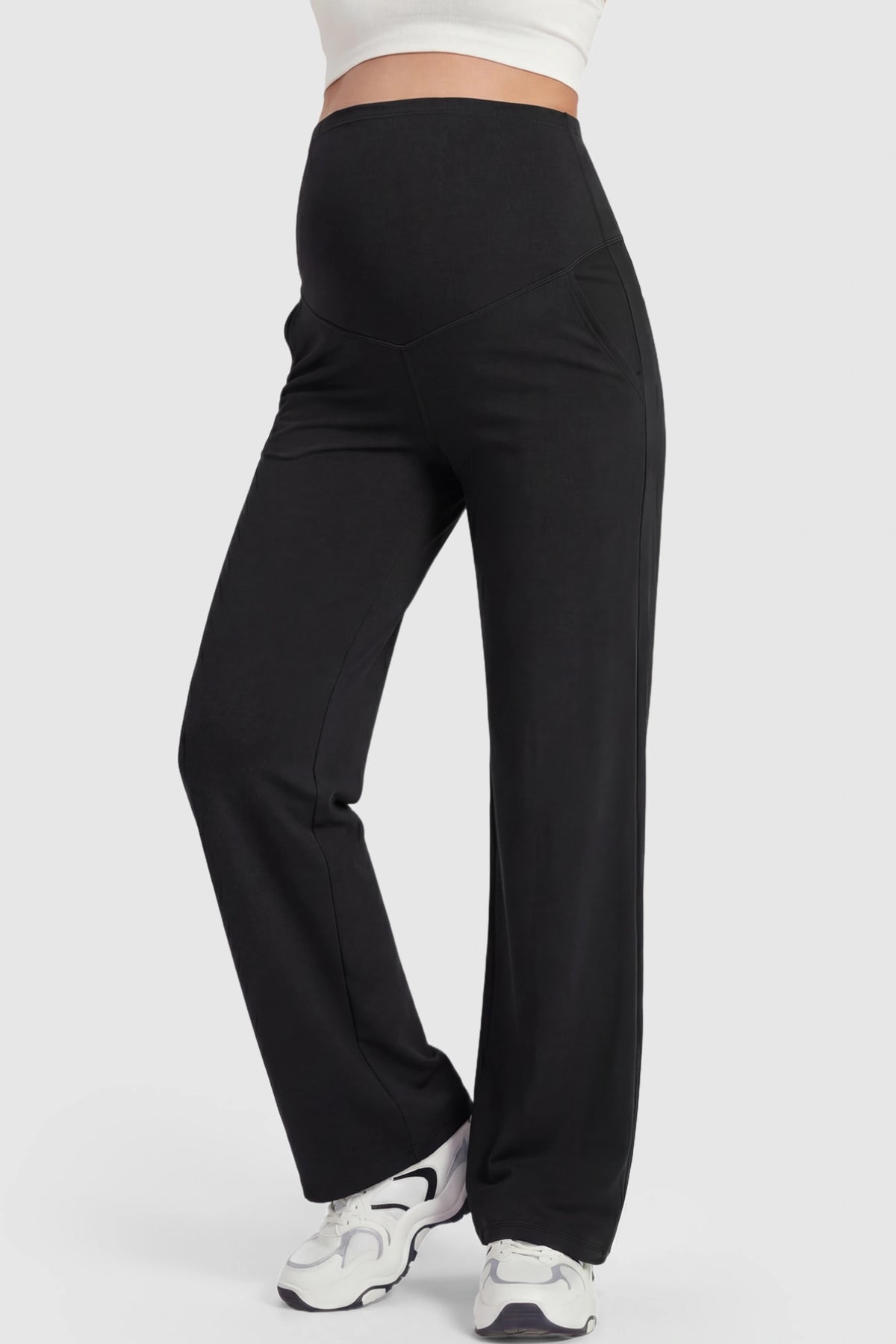 Full Panel High Waist Wide Leg Maternity Pants in Black featuring a supportive expansion-waist on a pregnant model showing front.