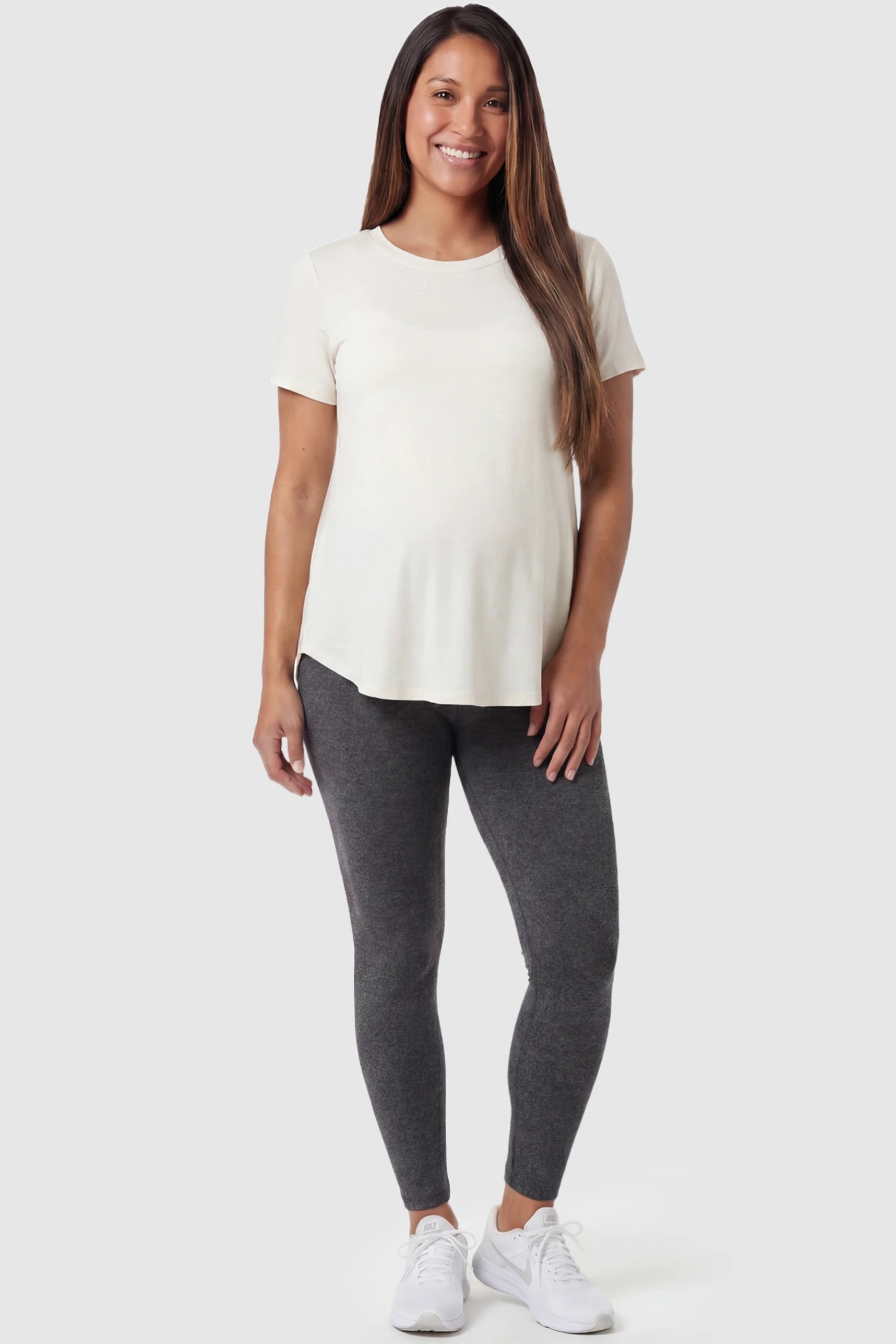 Full Panel Slim Fit Maternity Leggings in Dark Gray featuring a seamless over-the-belly waistband on a pregnant model, front view.