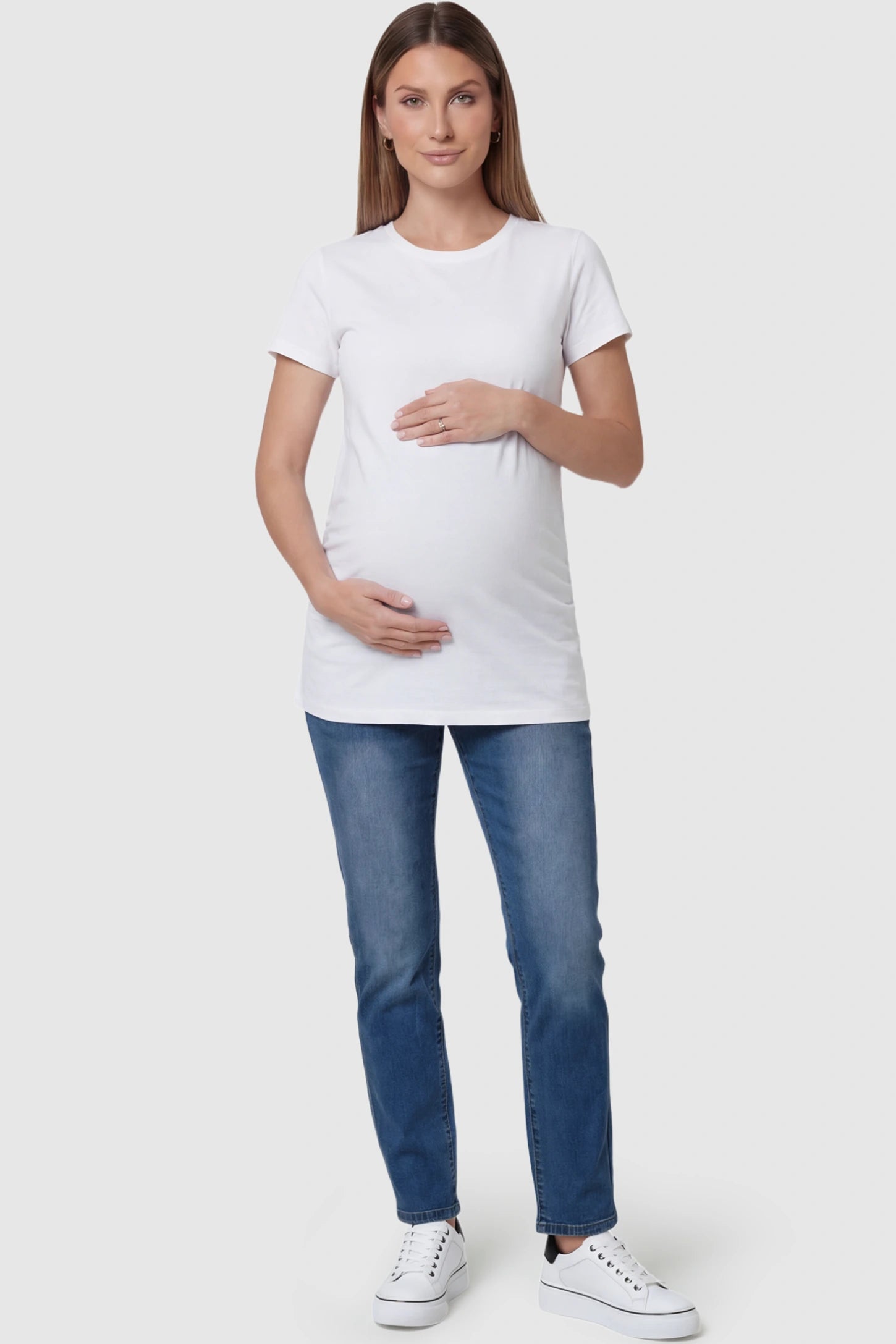 Full Panel Straight Leg Maternity Jeans in blue featuring a stretch support panel on a pregnant model facing front.