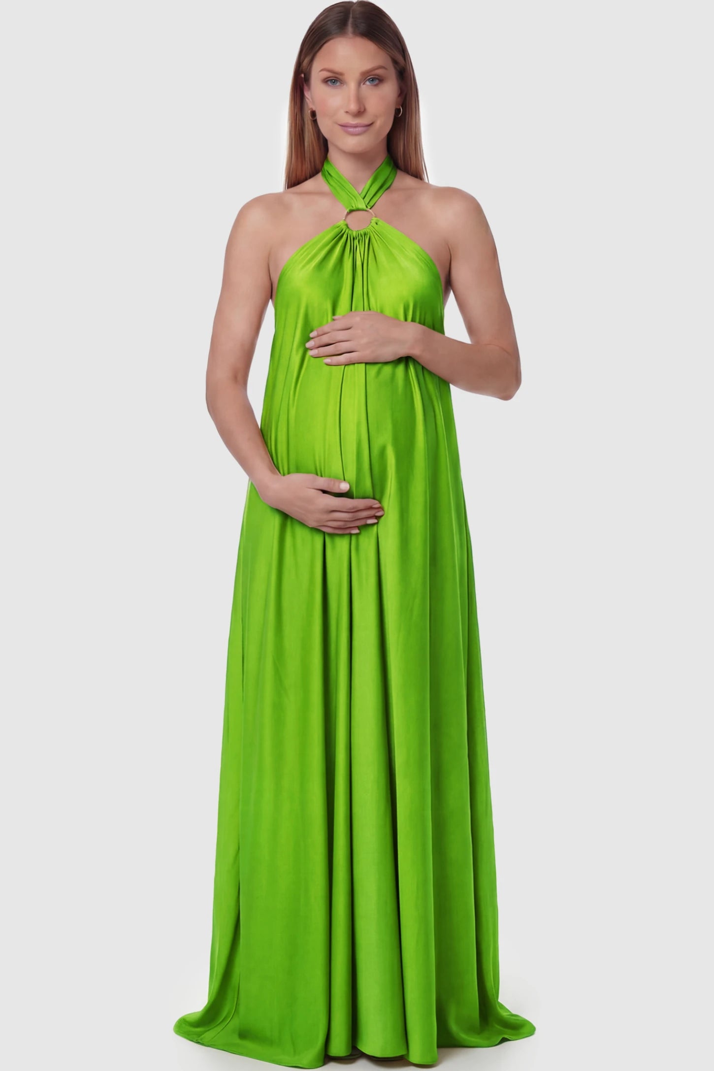 Solid Halter Neck Maternity Maxi Dress in Green featuring a flowing skirt on a pregnant model posing front.