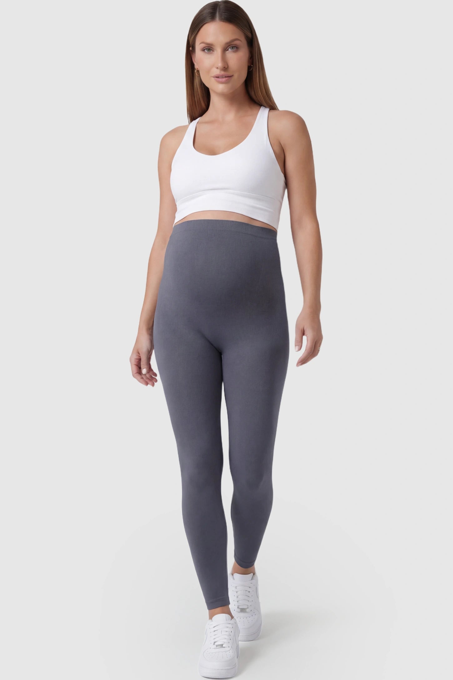 High Waisted Full Length Maternity Leggings in Gray featuring a seamless over-the-bump band on a pregnant model posing front.