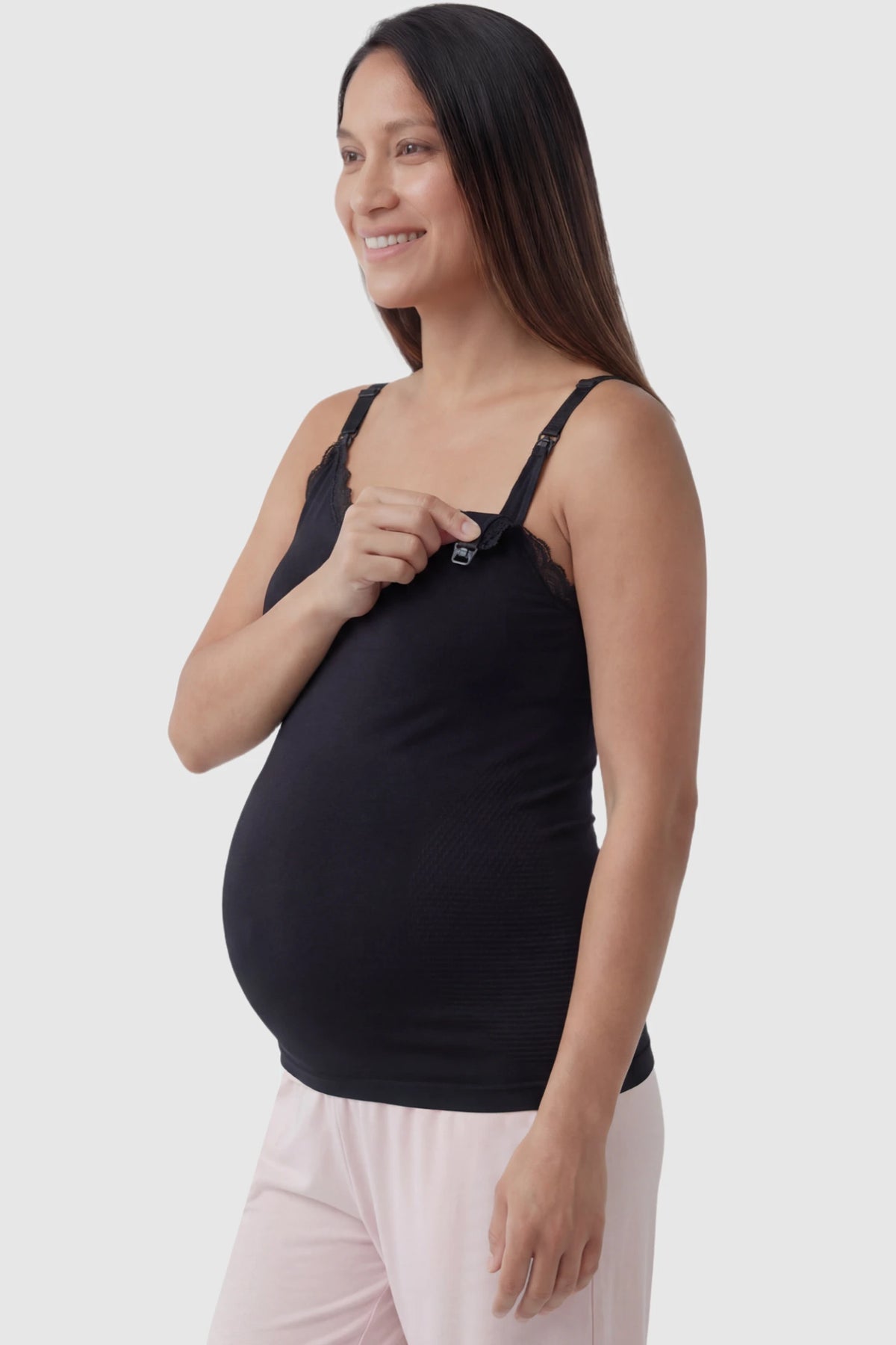 Lace Trim Wire Free Maternity Nursing Camisole in black offering one-handed nursing access on a pregnant model, side view.