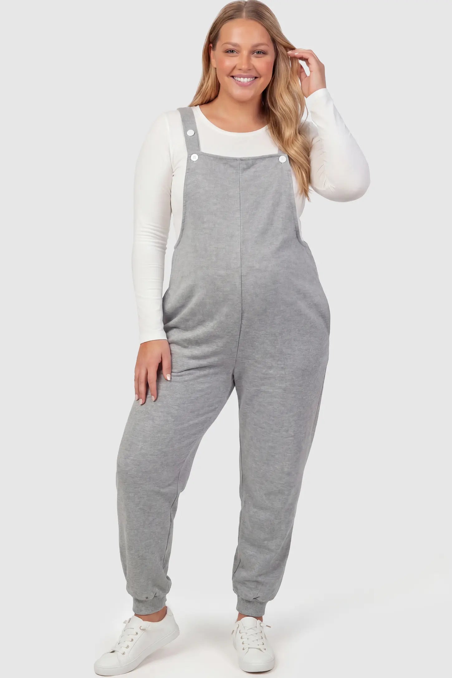 Sleeveless Square Neck Maternity Jogger Jumpsuit in Gray Jersey Knit with deep side pockets on a pregnant model.