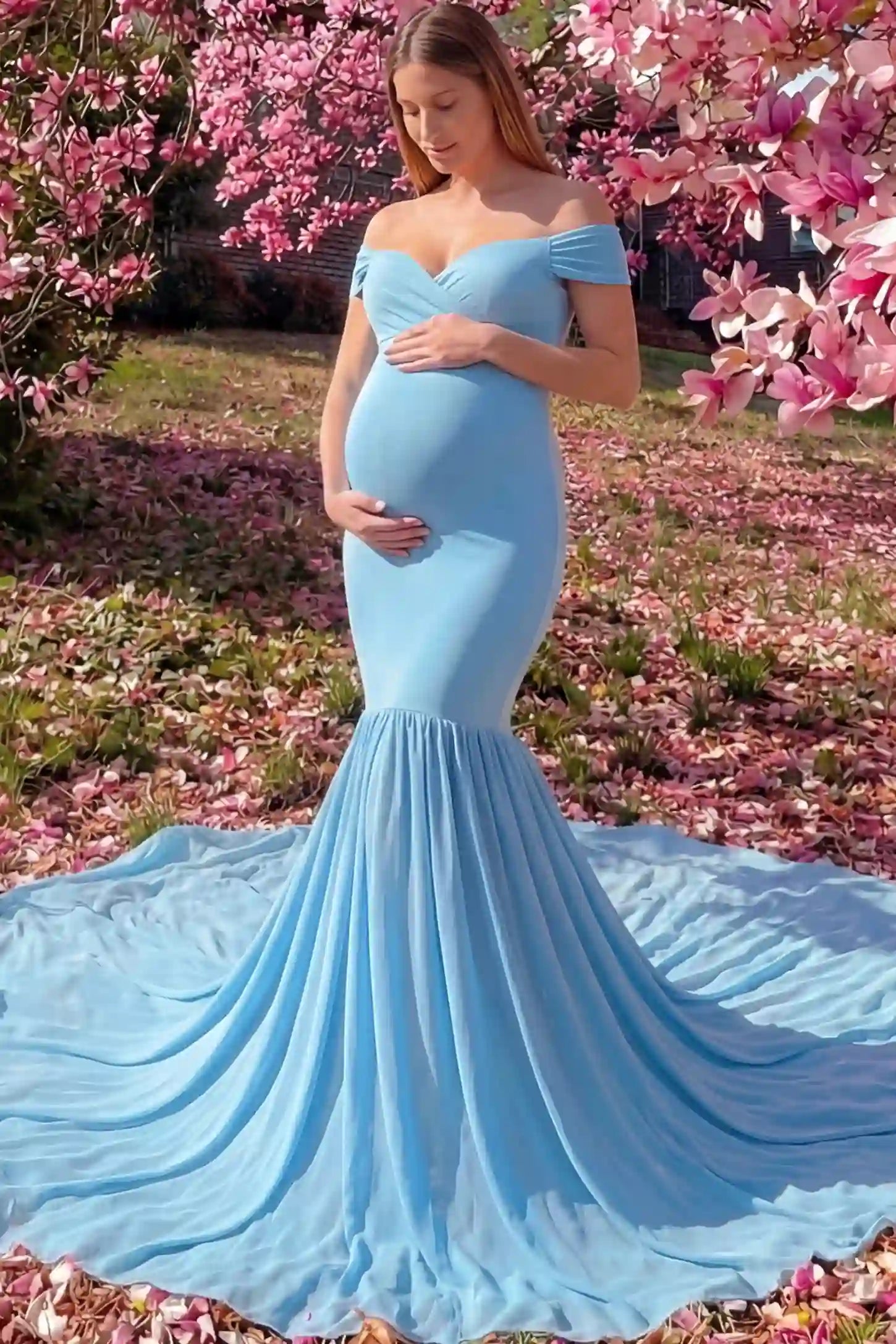 Solid Off Shoulder Mermaid Maternity Photoshoot Gown in Blue featuring a sweetheart neckline and dramatic pleated train on a pregnant model showing front.