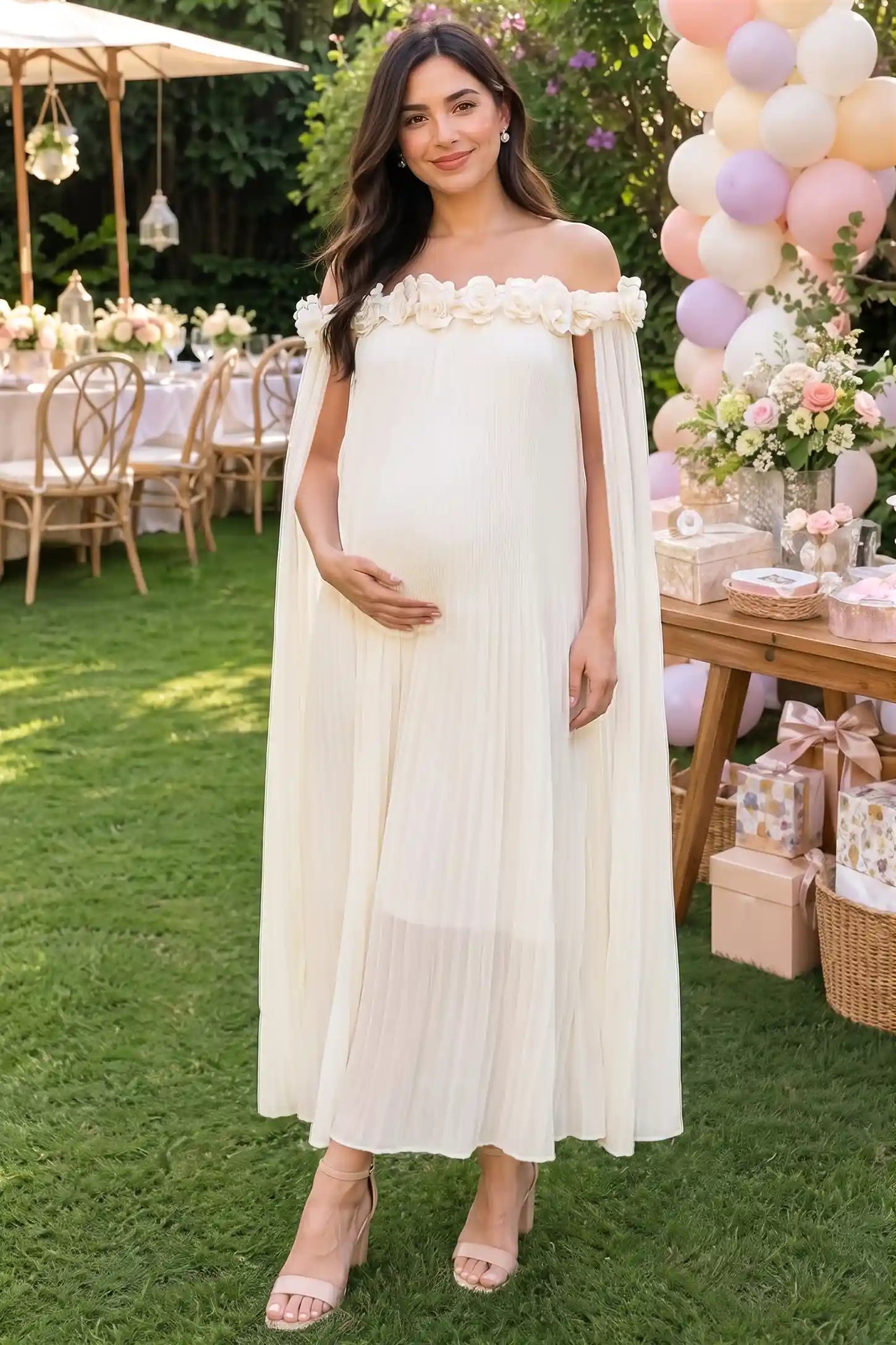 Pleated Off-Shoulder Maternity Gown with Rosettes in White with pleated details, lifestyle view on a pregnant model.
