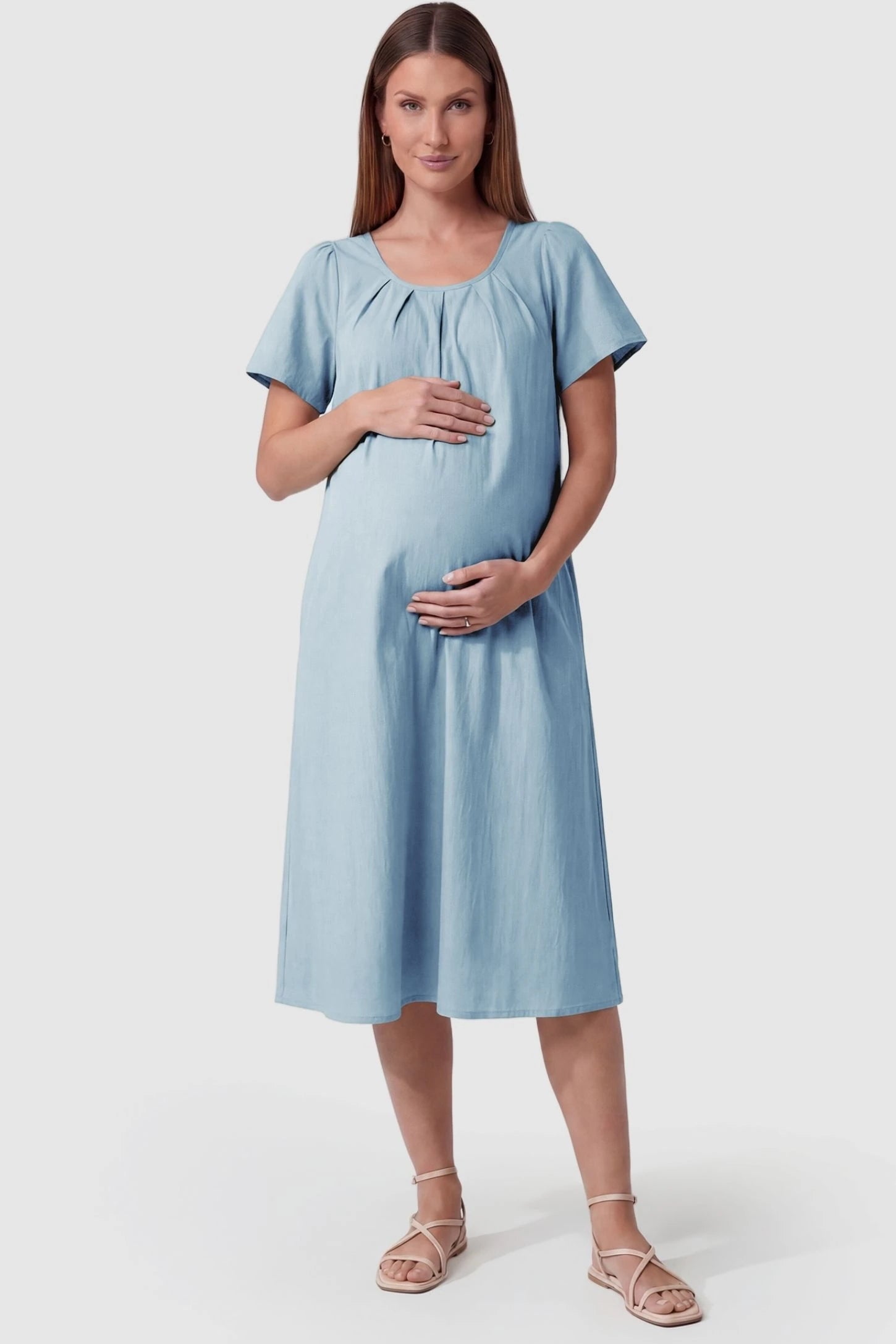 Pleated Round Neck Flowy Midi Maternity Dress in Blue featuring a pleated neckline on a pregnant model, front view.