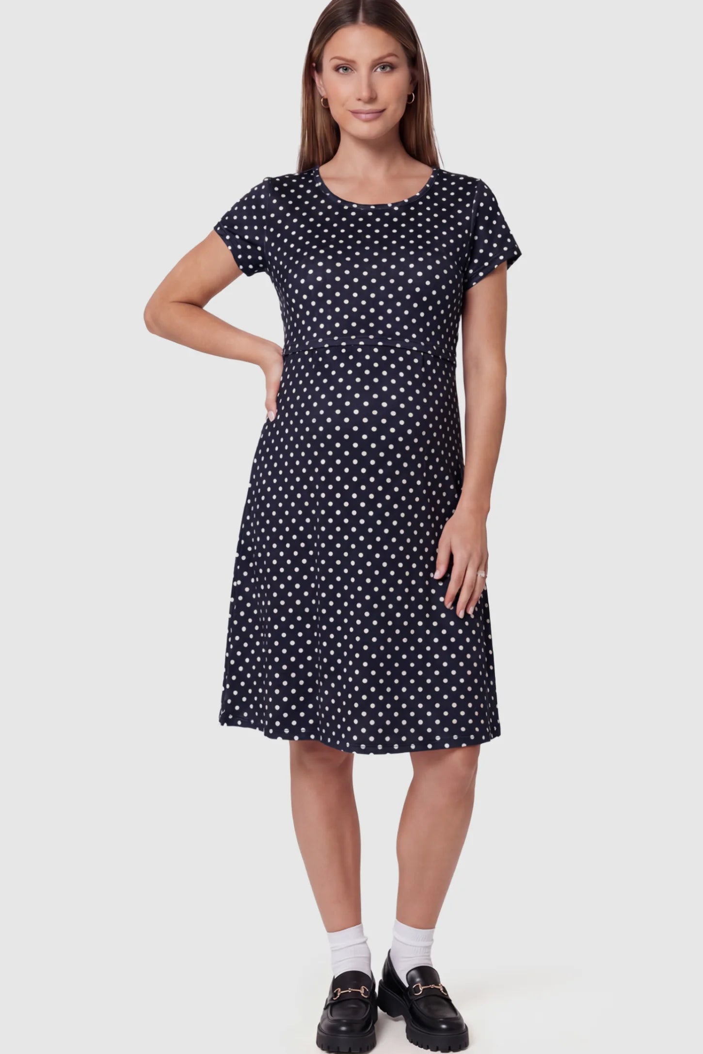 Polka Dot Scoop Neck Midi Maternity Nursing Dress in Navy blue featuring a discreet lift-up layer on a pregnant model showing front.