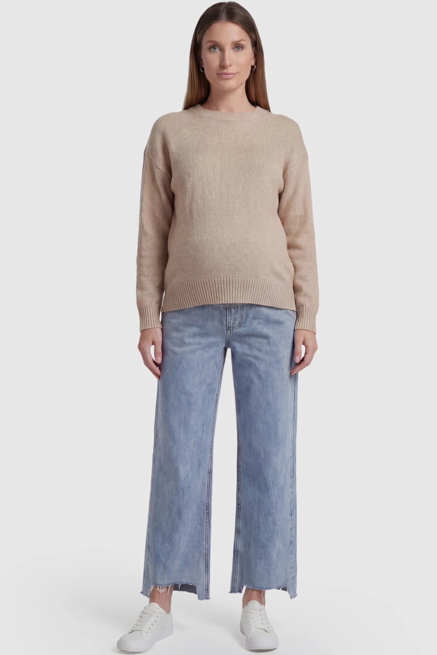 Raw Hem Wide Leg Maternity Jeans in Light Blue Denim with a grey over-the-belly comfort panel and raw hem on a pregnant model facing front.