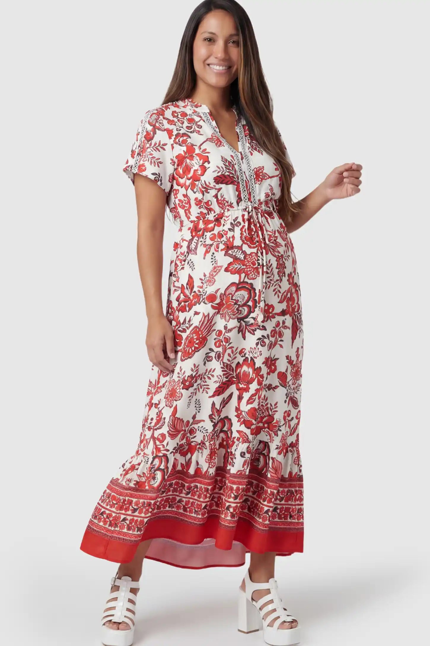 Retro Floral Print V-Neck Midi Maternity Dress in red featuring a cinched drawstring waist on a pregnant model posing front.