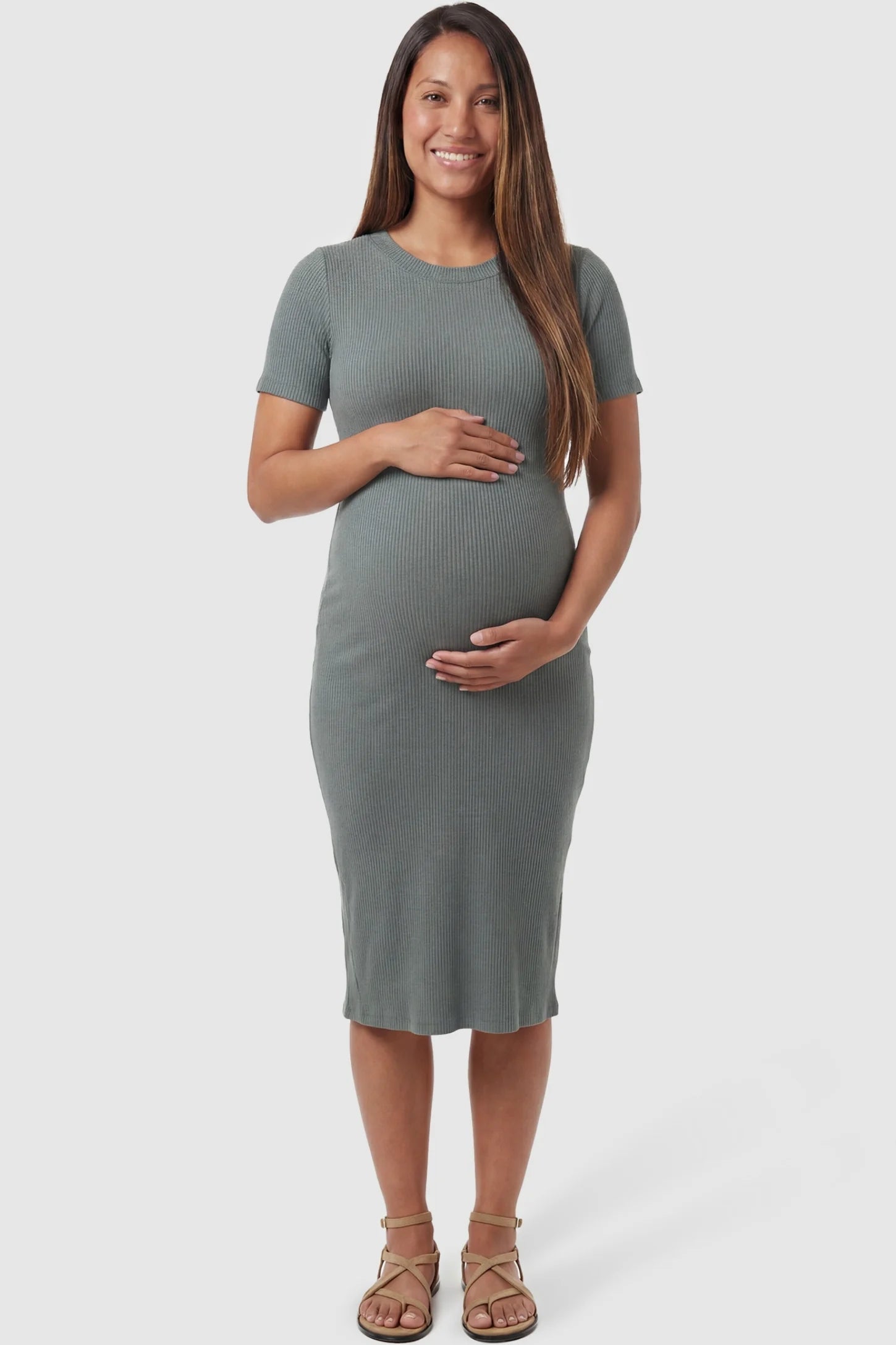 Ribbed Knit Short Sleeve Midi Maternity Dress in Green featuring a stretchy ribbed fabric that hugs the bump on a pregnant model, front view.
