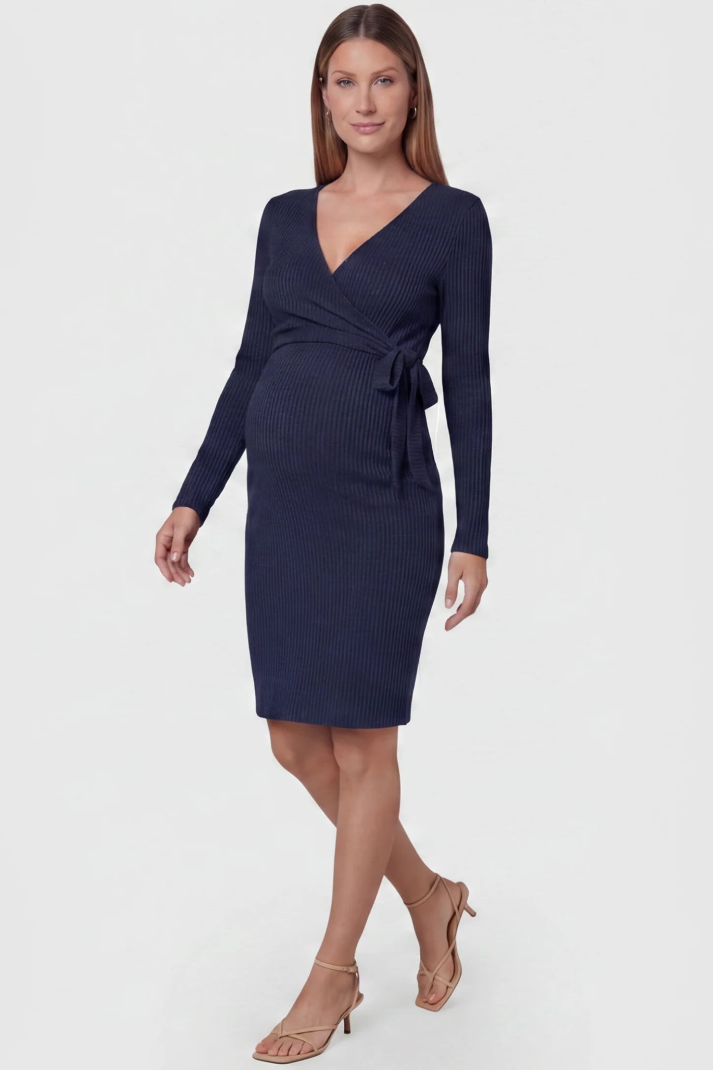 Ribbed Knit Wrap-Front Long Sleeve Maternity & Nursing Dress in Dark Blue featuring functional wrap bodice on a pregnant model, front view.