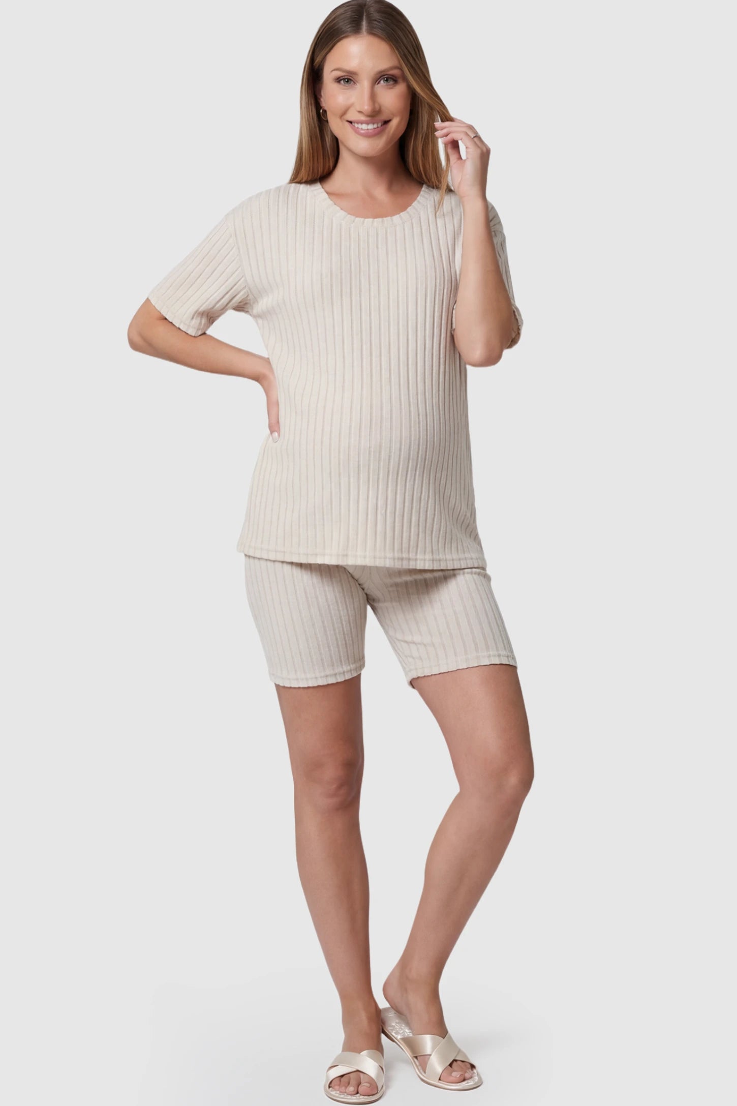 Ribbed Vertical Stripe Maternity Loungewear Set in White With pinstripes featuring a high-rise waistband on a pregnant model showing front.