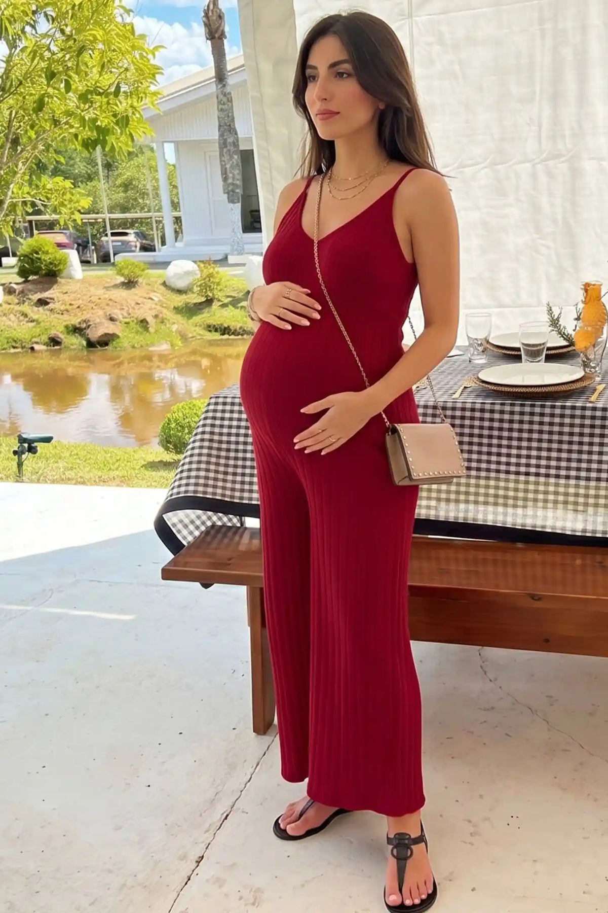 Ribbed Wide-Leg Maternity Camisole Jumpsuit in Red featuring a chic ribbed texture and wide-leg fit on a pregnant model, editorial lifestyle view.