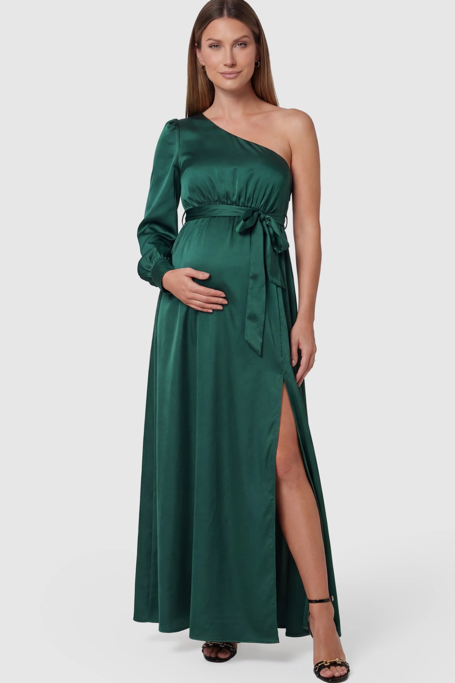 Satin One-Shoulder Belted Maternity Maxi Dress in Green featuring a side slit and waist tie on a pregnant model posing front.