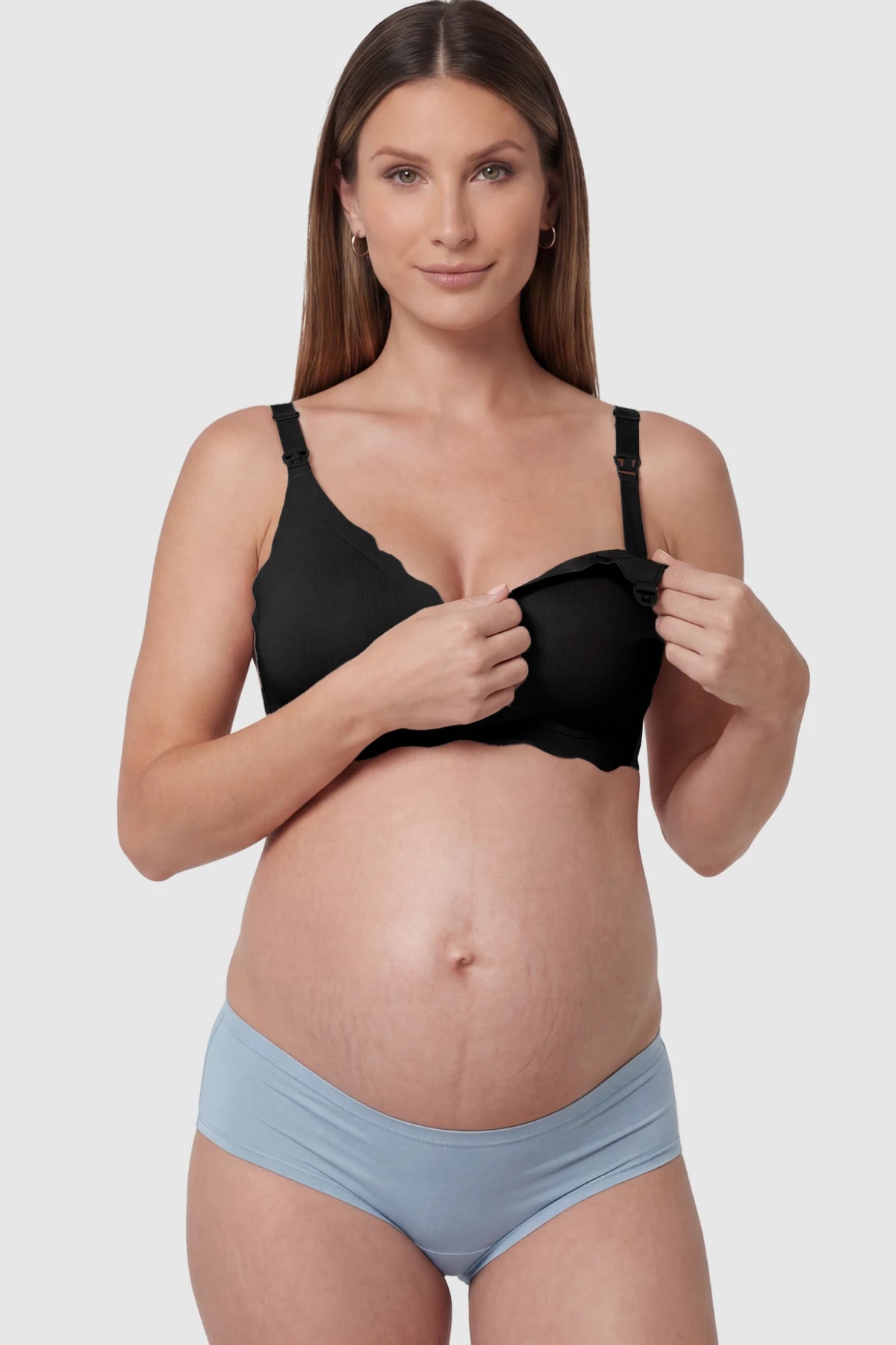 Scalloped Edge Wireless Maternity Nursing Bra in Black featuring drop-down clips on a pregnant model showing detail.