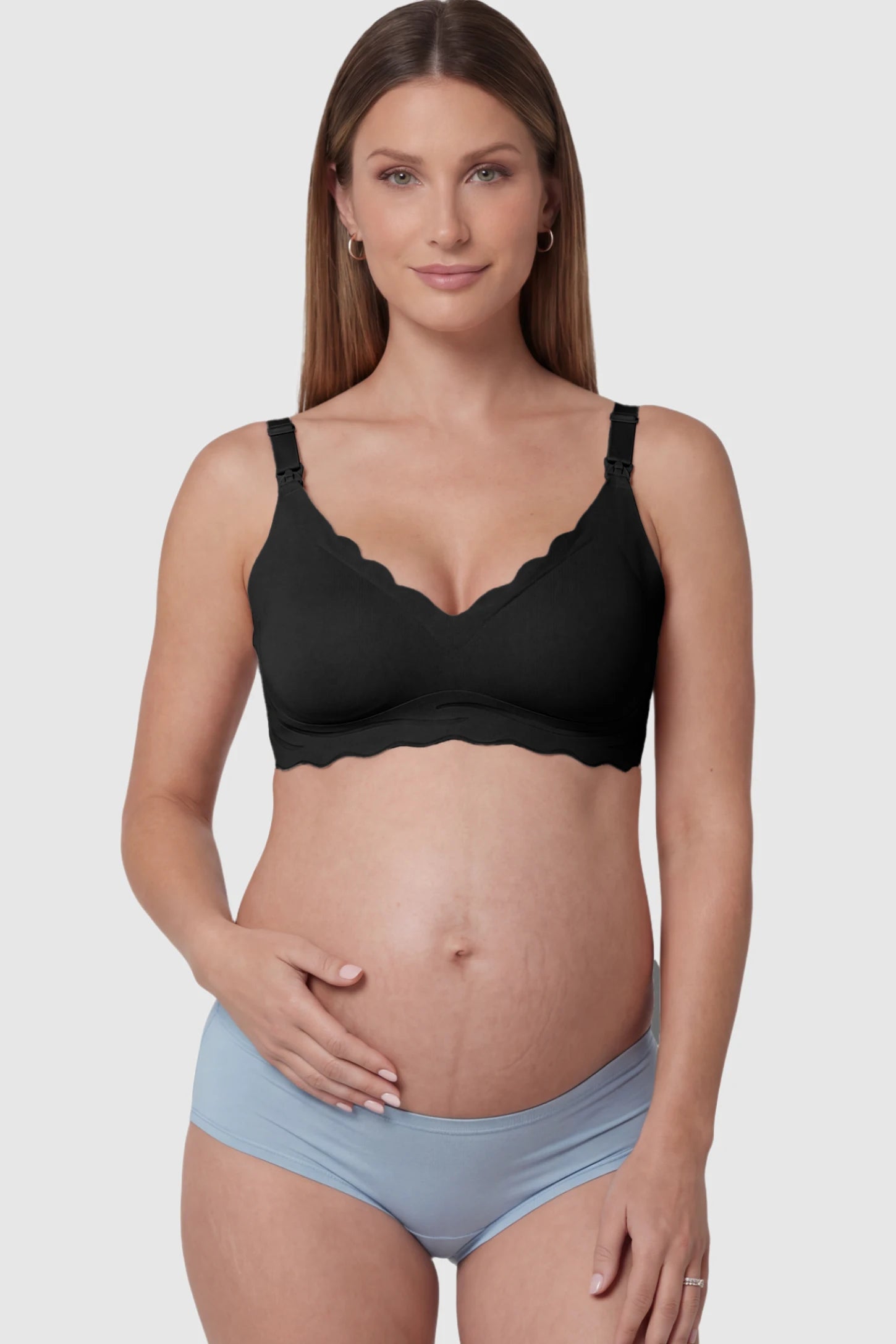 Scalloped Edge Wireless Maternity Nursing Bra in Black featuring drop-down clips on a pregnant model showing front.