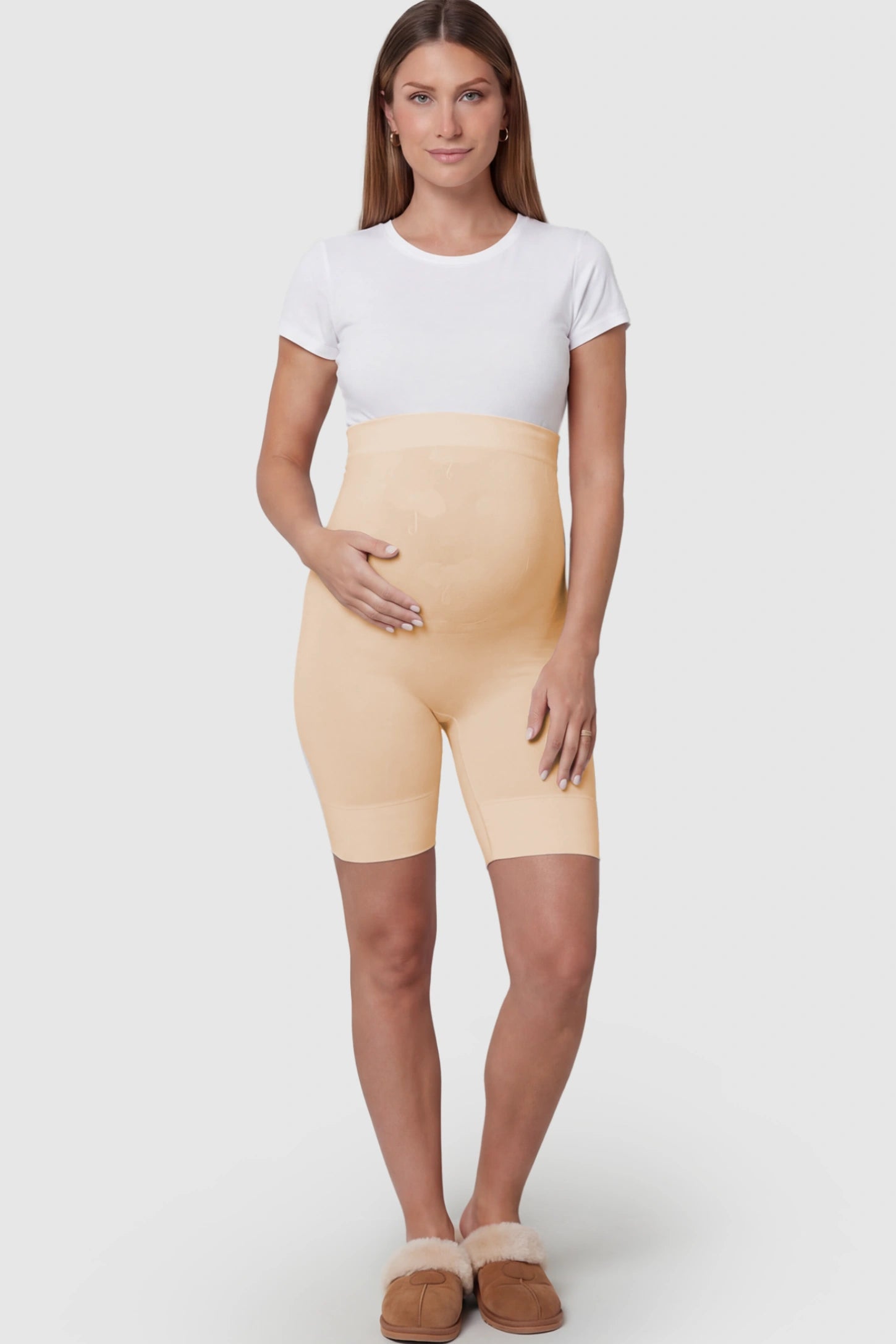 Seamless High Waist Support Maternity Shapewear Shorts in Skin Color featuring over-the-belly panel on a pregnant model showing front.