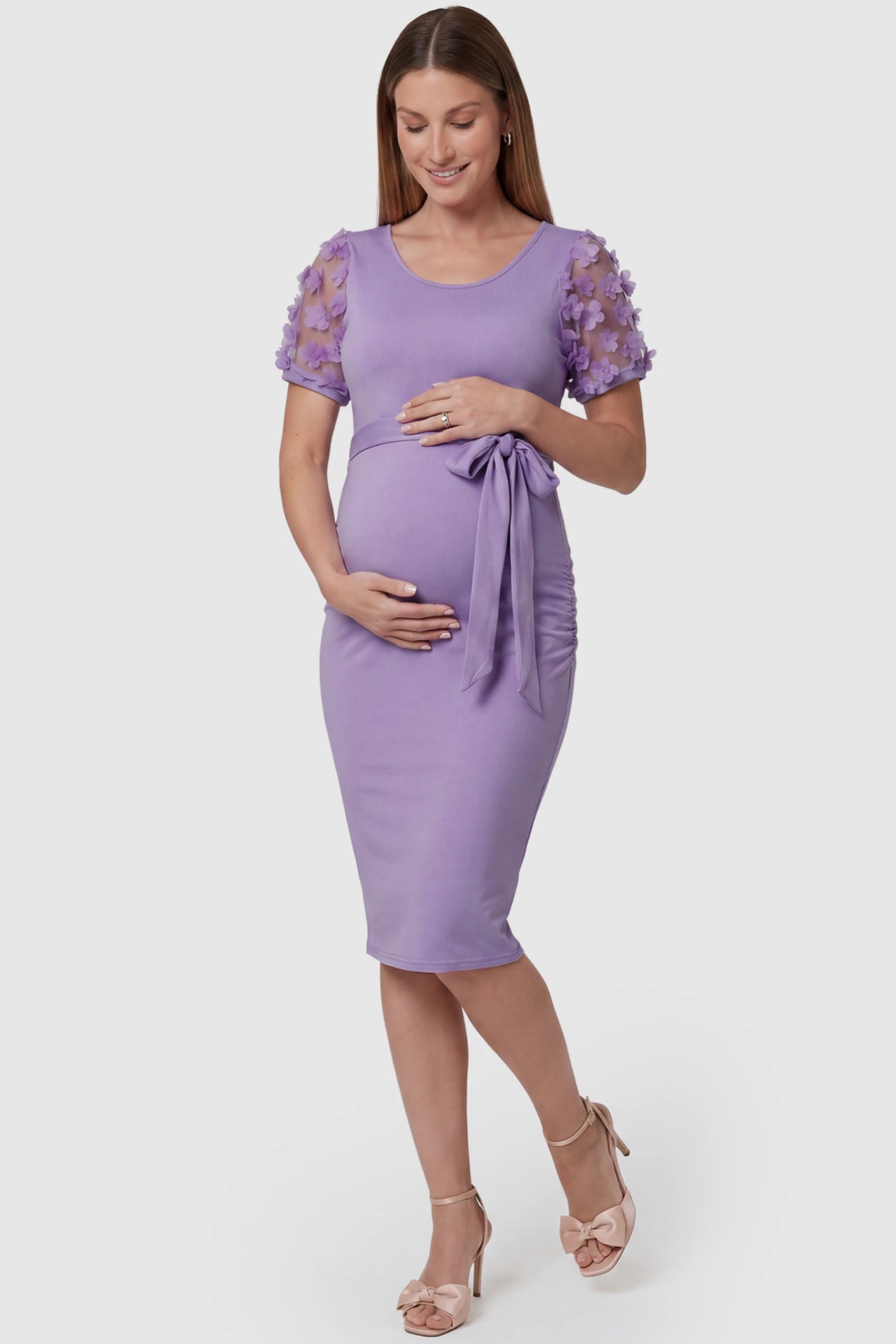Side Ruched Round Neck Short Sleeve Maternity Short Dress in purple featuring floral-detailed sleeves on a pregnant model, front view.
