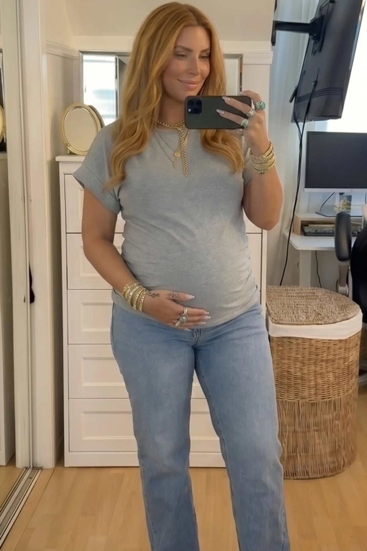 Solid Round Neck Cap Sleeve Maternity Top in Light Gray featuring breathable fabric on a pregnant model taking a mirror selfie indoors, front view.