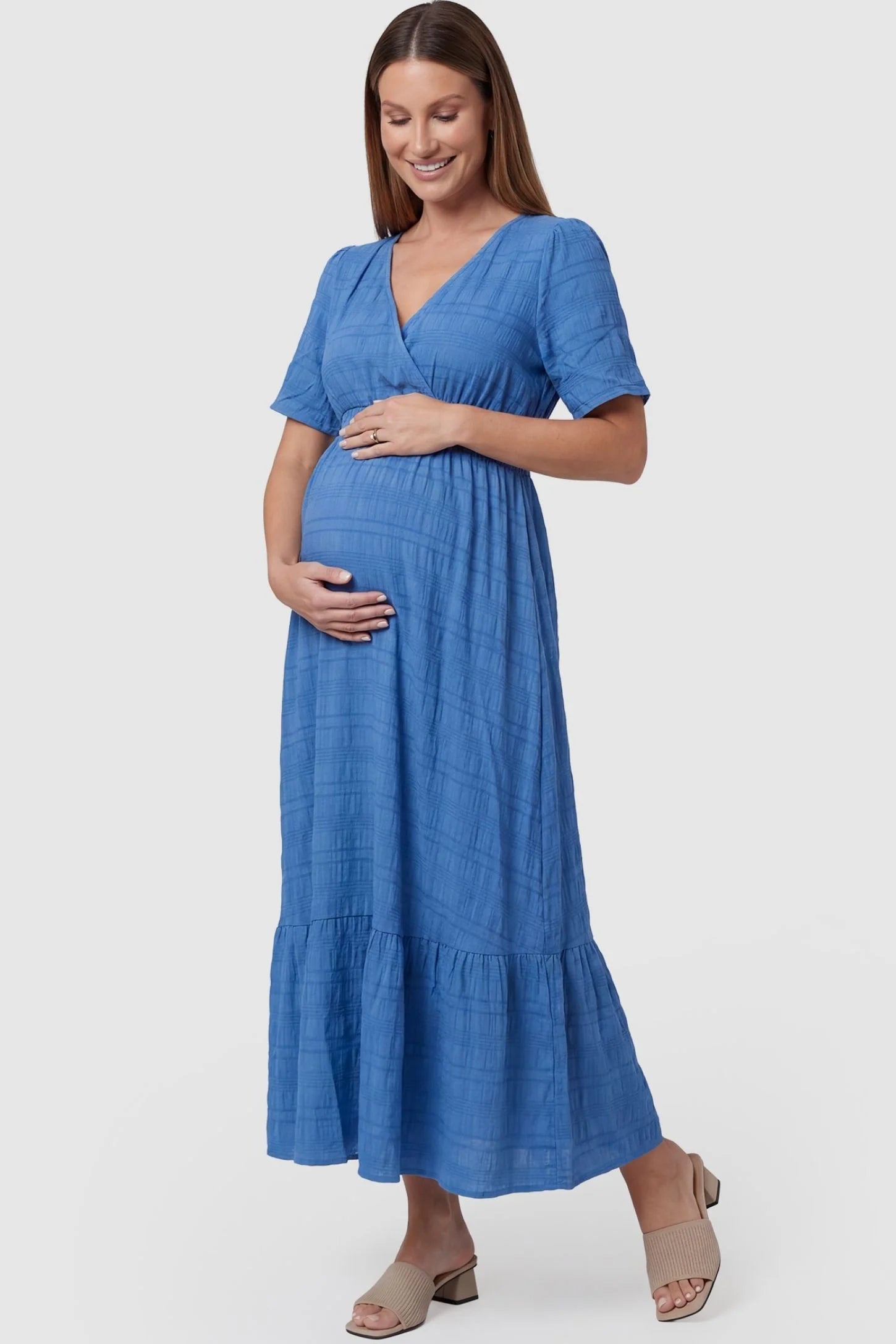 Textured Knit Butterfly Sleeve Midi Dress in Blue featuring feminine short butterfly sleeves on a pregnant model, front view.