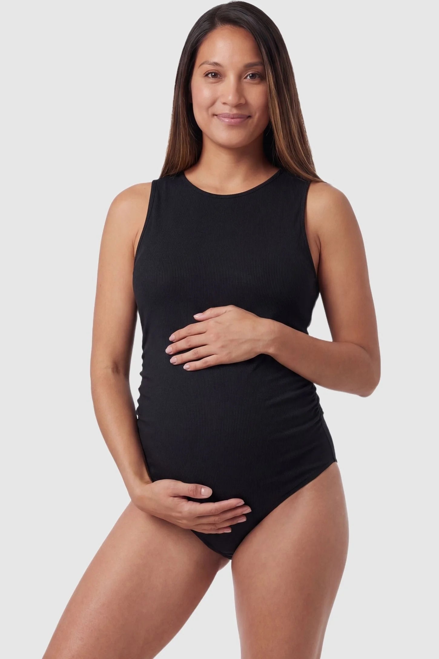Tie-Back High-Neck Maternity Monokini in Black featuring a ribbed stretch fabric on a pregnant model, front view.