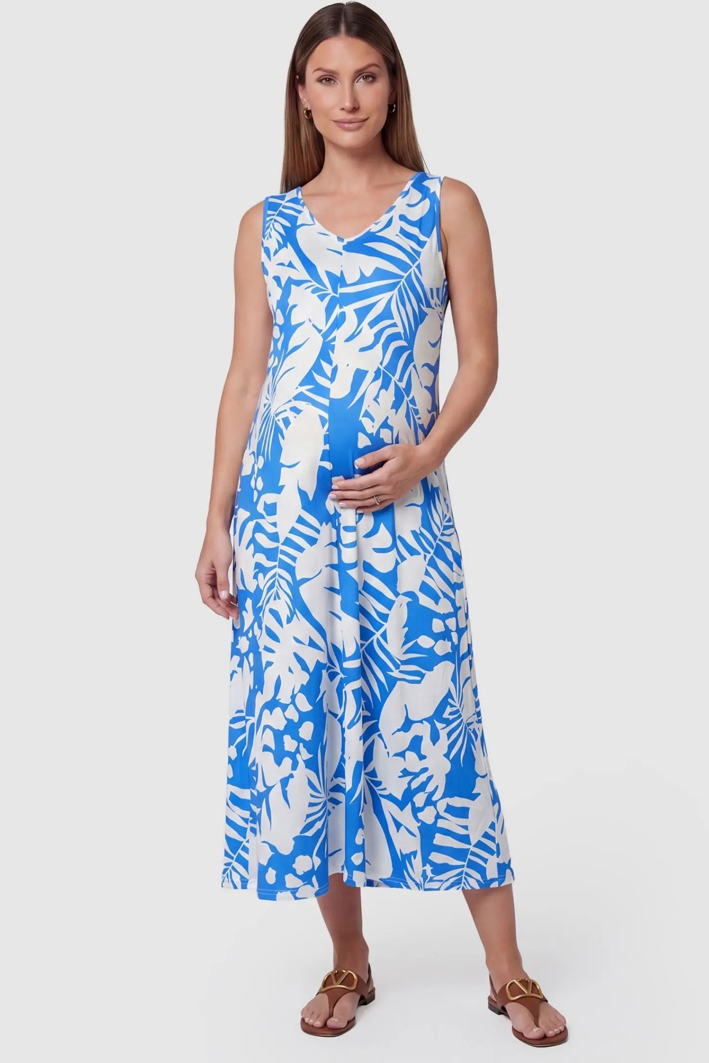 Tropical Print Sleeveless Midi Maternity Dress in Blue featuring a flattering V-neckline on a pregnant model, front view.