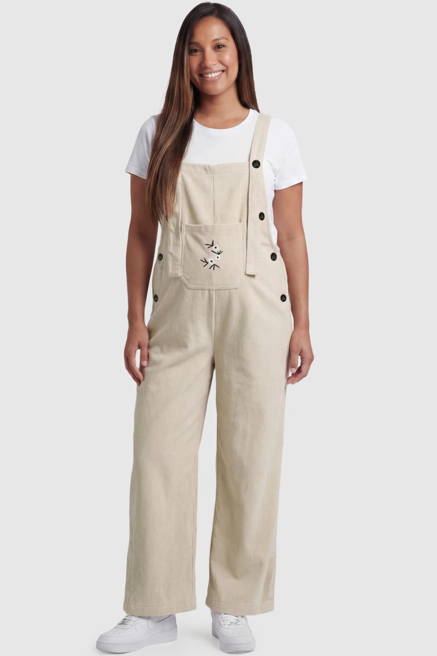 Floral Embroidered Wide-Leg Maternity Overalls in apricot featuring adjustable straps on a pregnant model, front view.