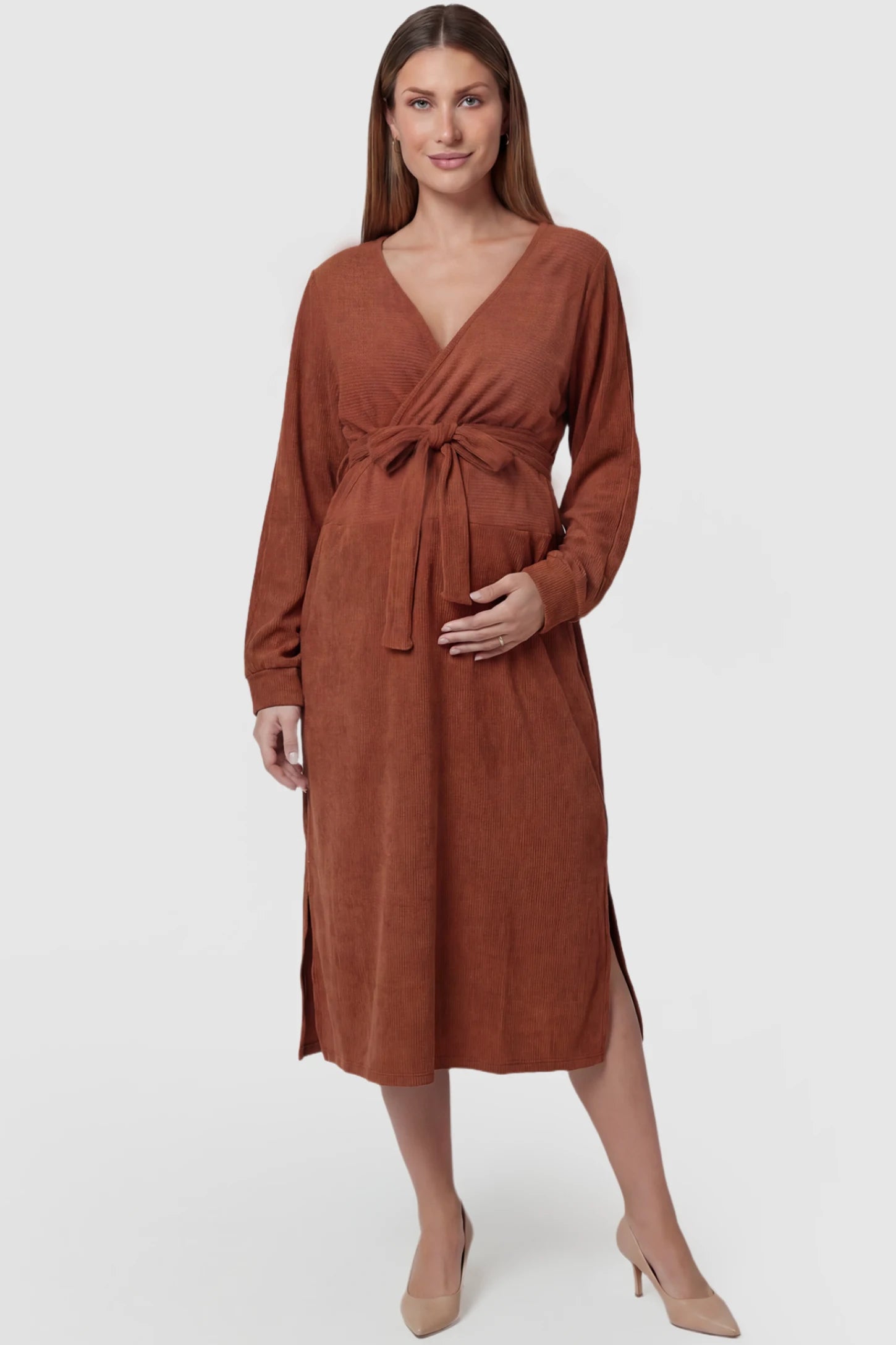 Wrap Front Tie Waist Long Sleeve Maternity Midi Dress in Orange featuring adjustable tie waist and side slits on a pregnant model, front view.