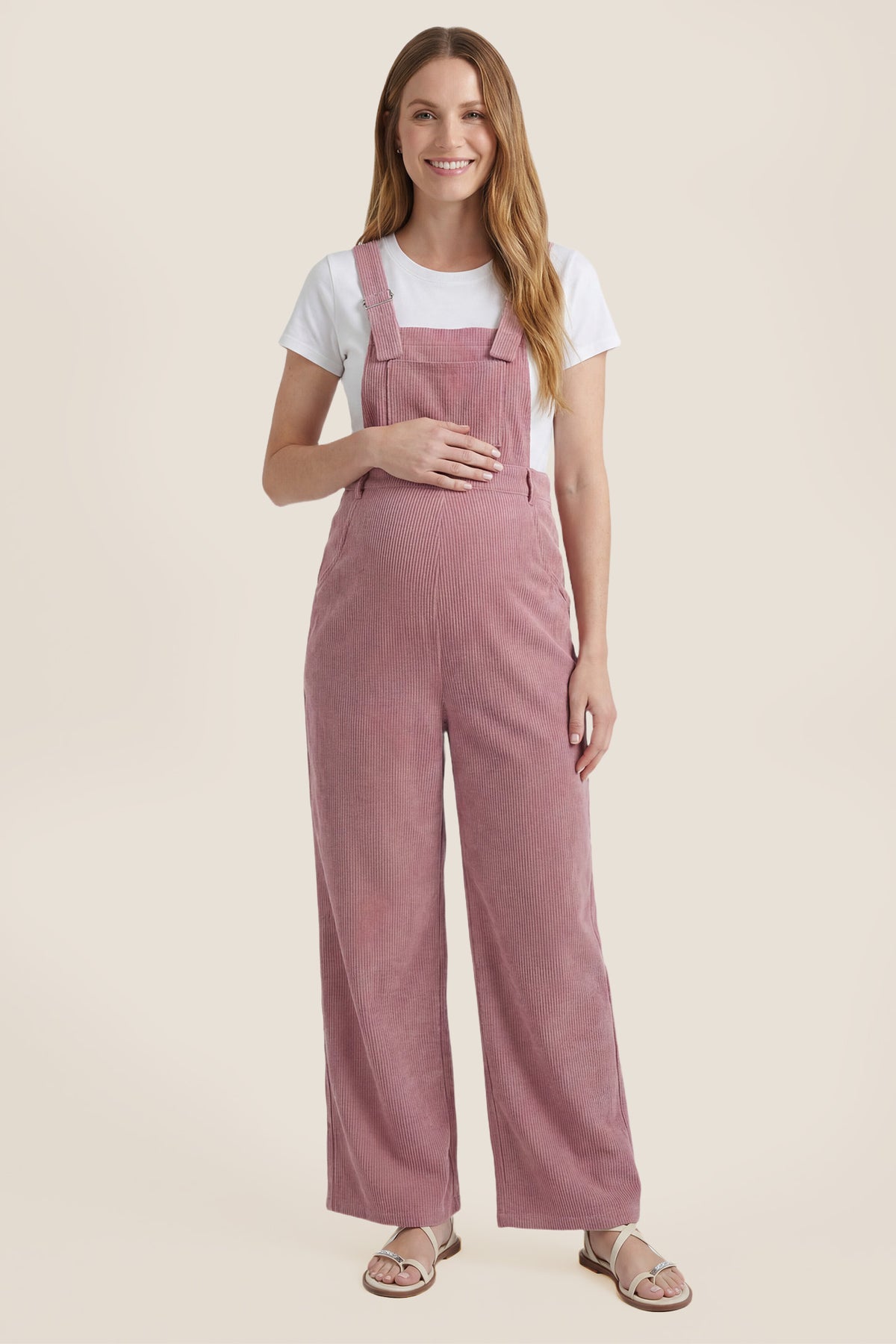 Front view of pink corduroy wide leg maternity jumpsuit