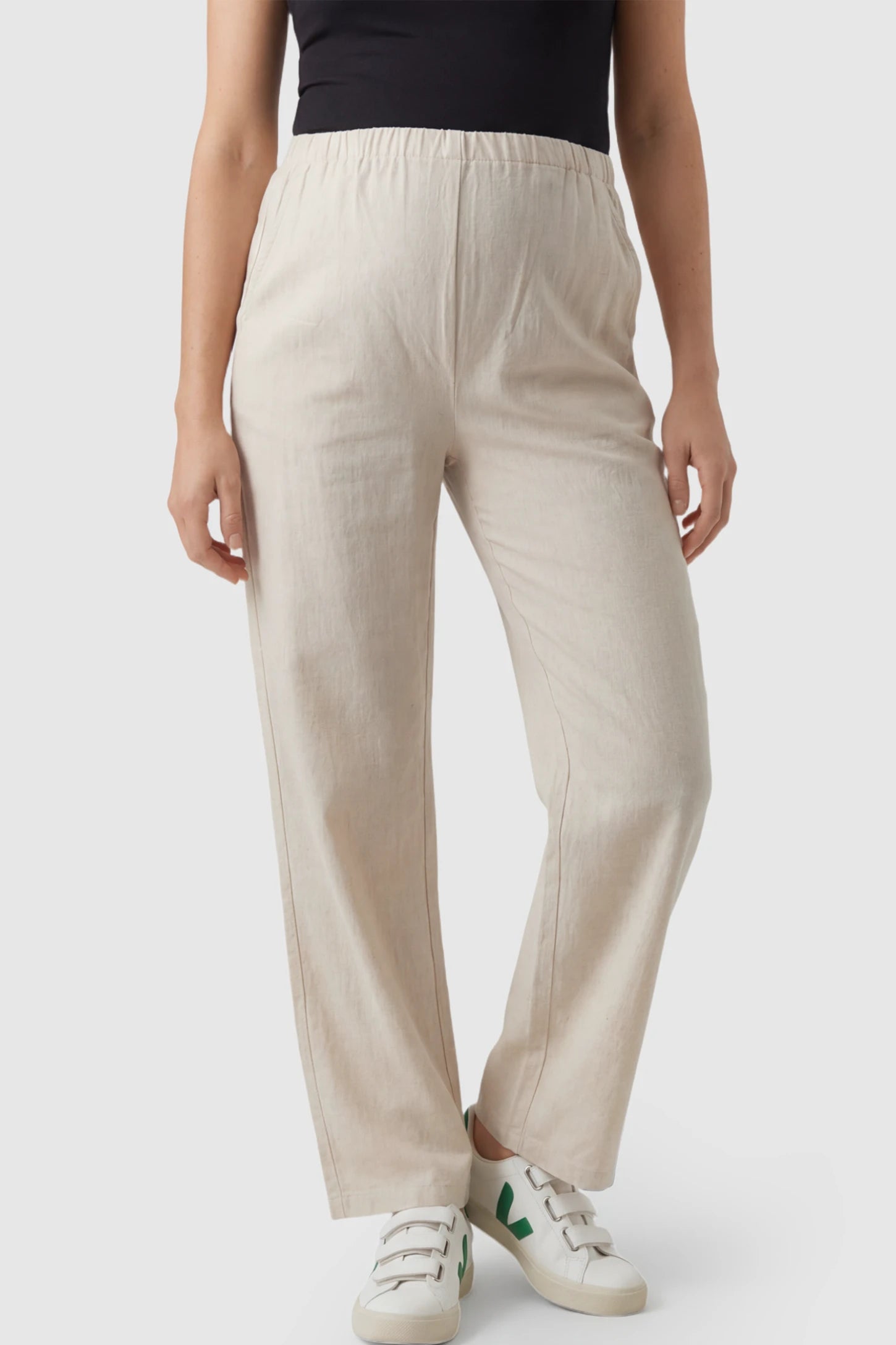 Adjustable Elastic Waist Wide Leg Maternity Pants Adjustable Elastic Waist Wide-Leg Maternity Pants in Beige featuring a customizable button-hole waistband on a pregnant model showing front.