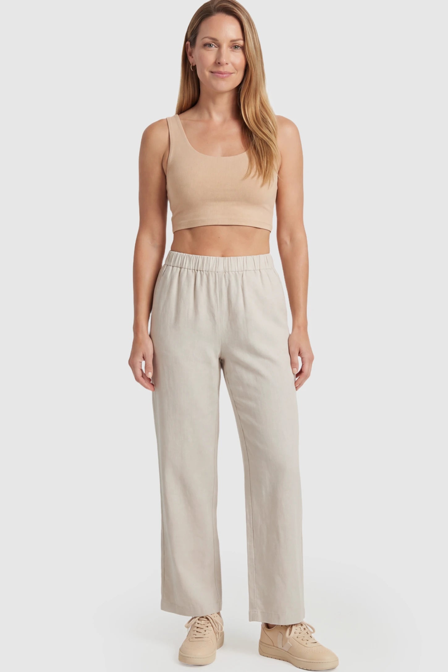 Adjustable Elastic Waist Wide Leg Maternity Pants Adjustable Elastic Waist Wide-Leg Maternity Pants in Beige featuring a customizable button-hole waistband on a postpartum model facing front.