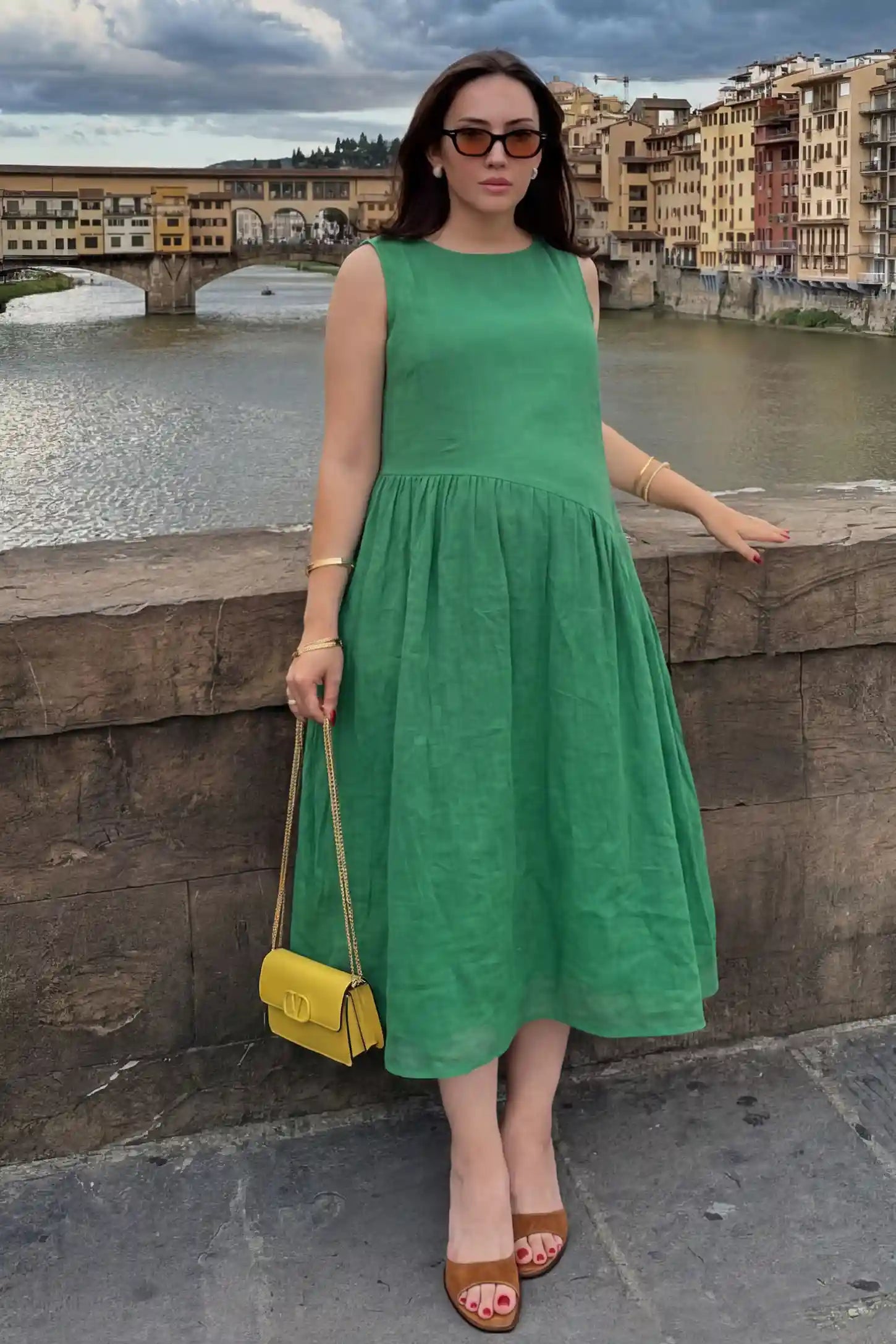 Sleeveless Pocketed A-Line Maternity Midi Dress Sleeveless pocketed A-line maternity midi dress in green with sleeveless cut, front view on pregnant model