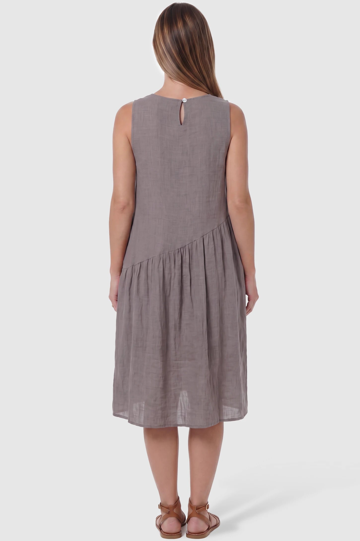 Sleeveless Pocketed A-Line Maternity Midi Dress Sleeveless pocketed A-line maternity midi dress in light taupe with sleeveless cut, back view on pregnant model